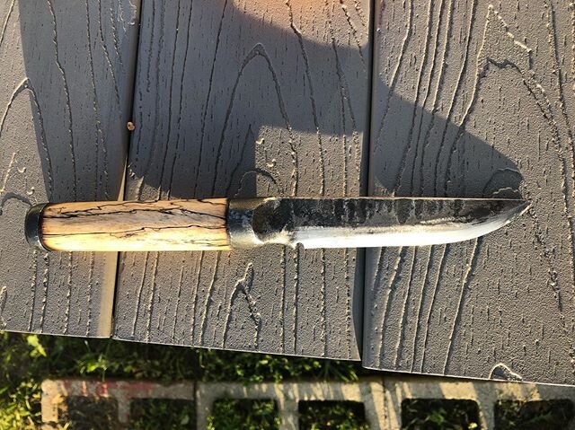 Knife is done. O1 tool steel and  Integral tang with stabilized wood handle. This knife was made in a pretty old fashioned shop with old fashioned techniques. Nearly me power tools used. Next one will be better, I&rsquo;m sure.  #blacksmithing #blade