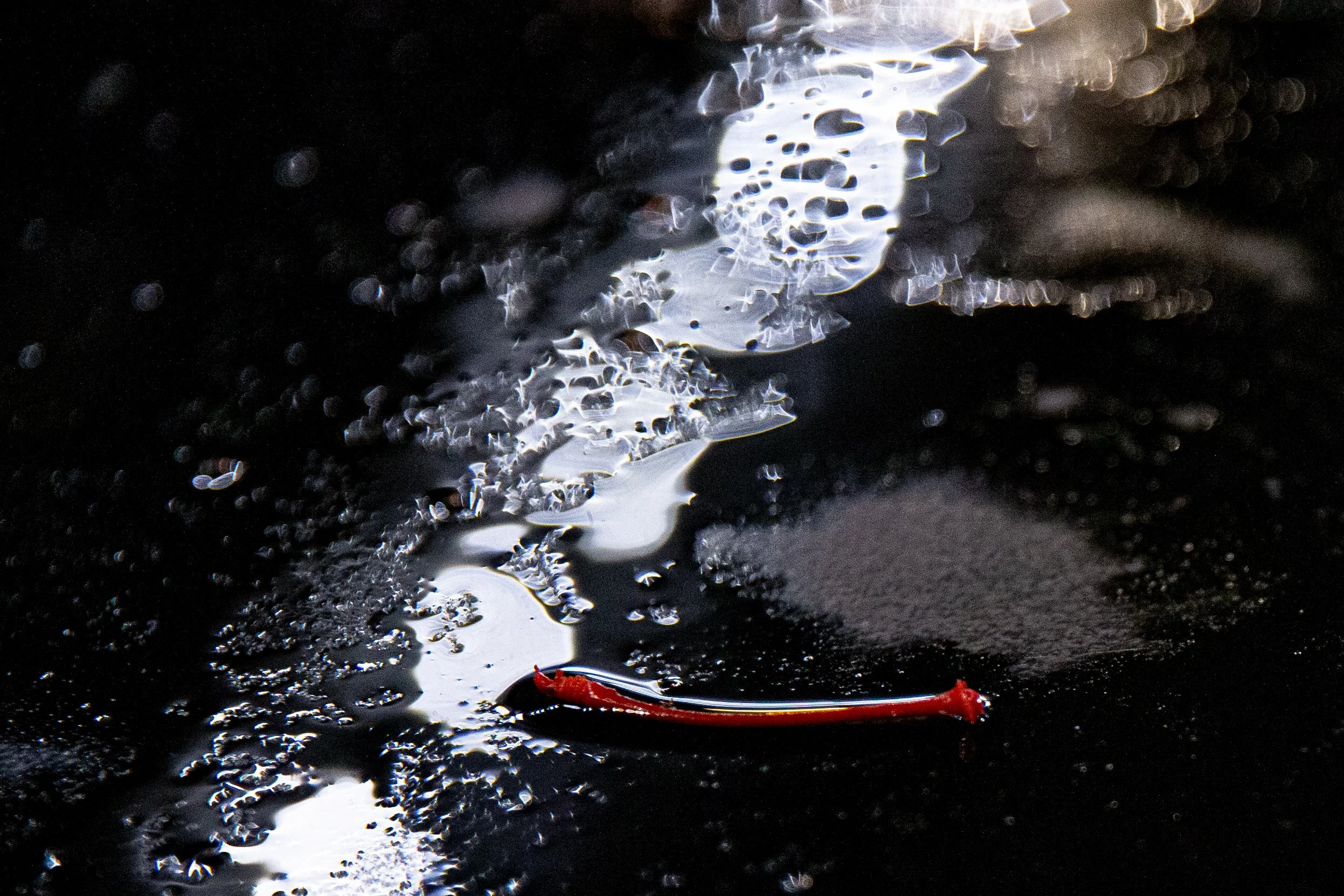 A cherry stem on a table outside of Broney’s Bar and Grill in Athens, Ohio during the spring of 2022. With the annual Mom’s Weekend approaching, male bartenders recount abuse and harassment at the hands of out of unhinged visiting  mothers.  