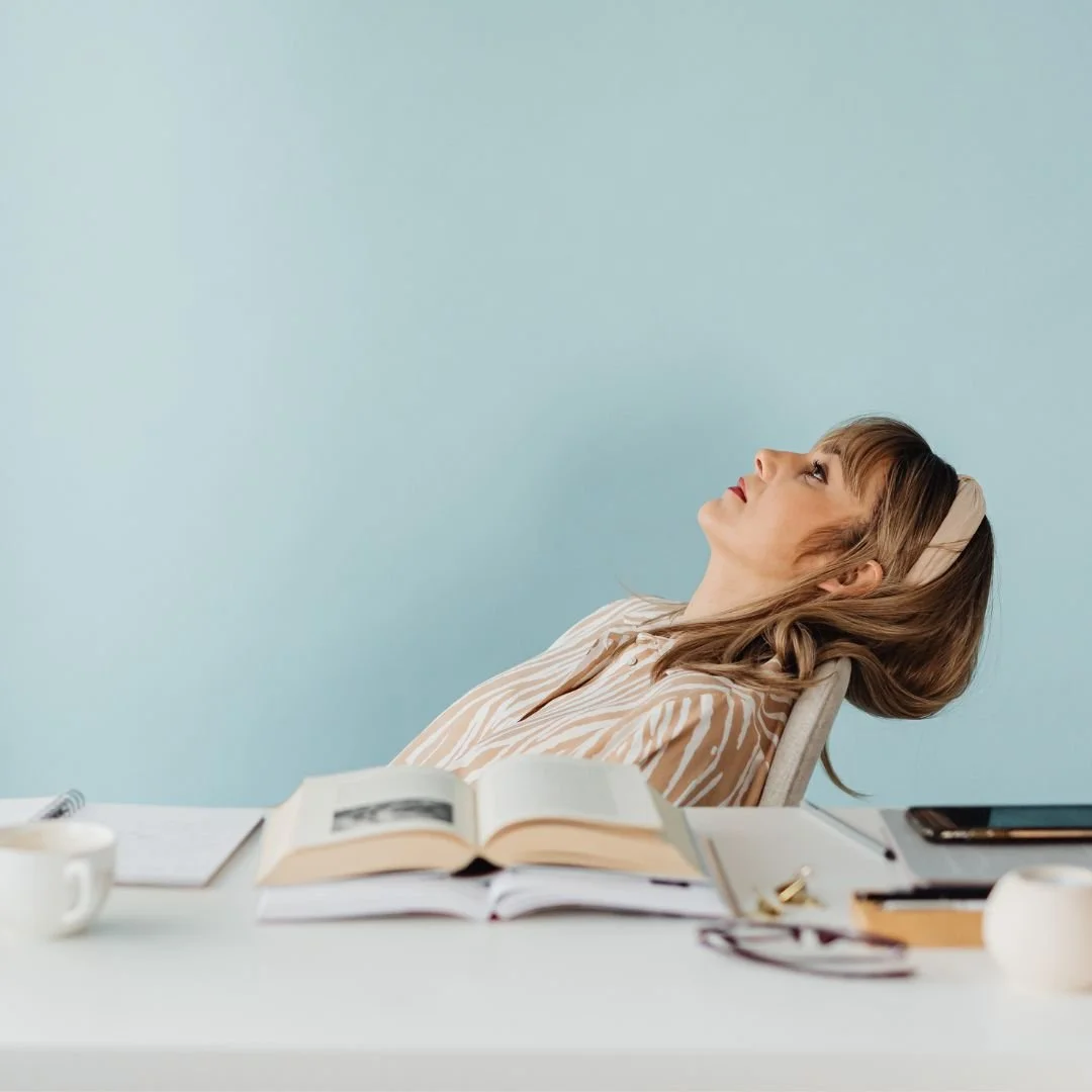 woman-leaning-head-on-chair-adult-adhd-overwhelm.jpg
