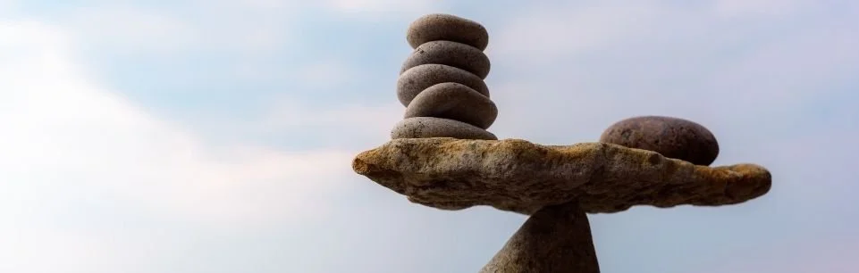 Illustration of an uneven balance scale representing the unfair comparison between personal struggles and others’ visible achievements