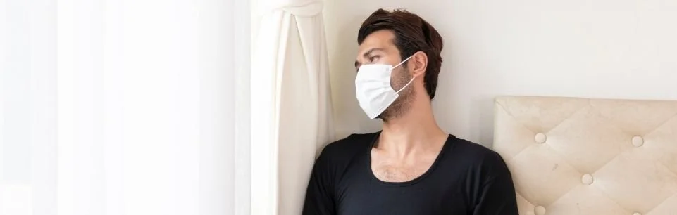 Adult man with ADHD feeling overwhelmed and stressed during COVID-19 pandemic.