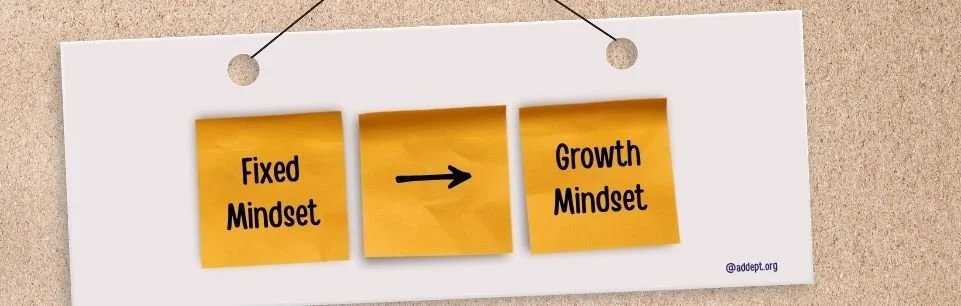 Sticky notes on a board show a shift from fixed mindset to growth mindset, with an arrow between them, illustrating mindset change for adults with ADHD.