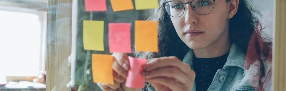 Adult with ADHD using visual reminders, medication cues, and calendar alerts to manage object permanence and stay organized.