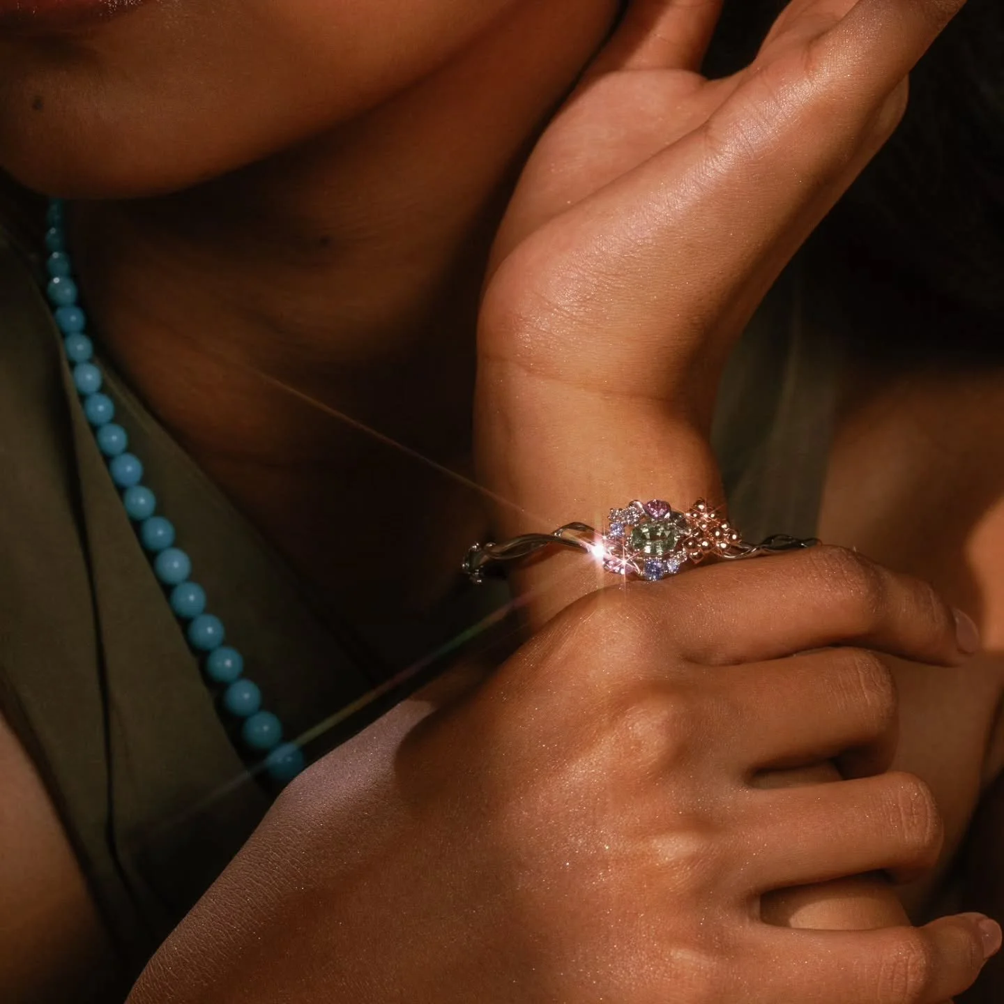 Gleaming from afar.

"Under the Blue Sky" Bangle in Sapphires and Diamonds
1.40ct oval natural mint green sapphire, Madagascar, low heated
0.16ctw round natural diamonds VS F-G
0.29ctw total marquise Sri Lankan sapphires in teal, green, and