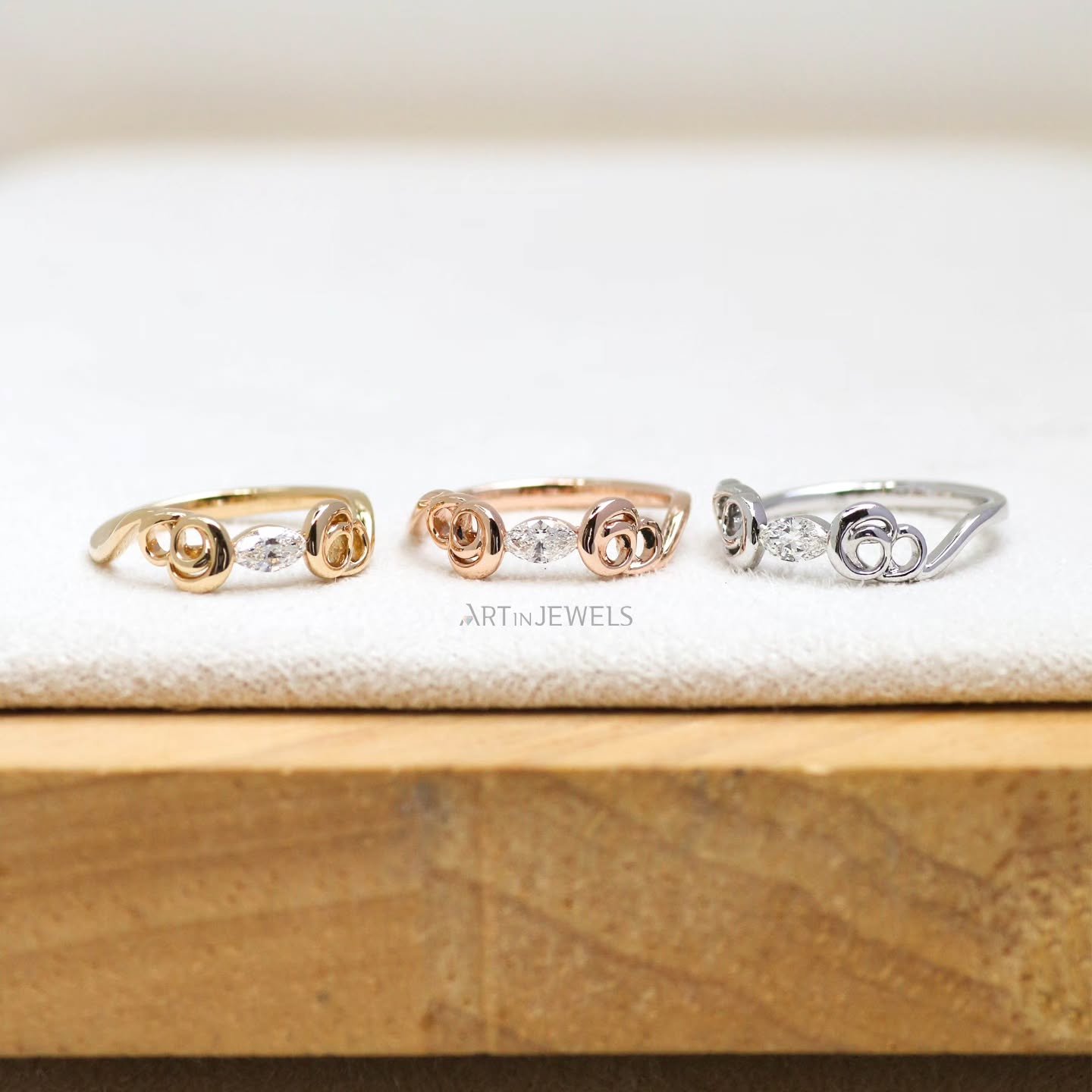 Sweet ribbons of gold nuzzle a dainty diamond center, like a quiet moment, a little secret.

Our Pinky Promise Rings are available in 18K white, yellow, and rose gold, each is mounted with a beautiful 0.13ct marquise natural diamond, VS F to G color
