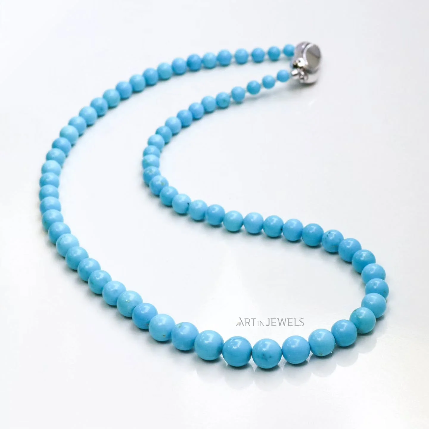 A string of blue sky.

Featuring a hard-to-find selection of round 4mm to 8.5mm Robin's egg color turquoise. 71 beads with a custom sterling silver lock.

*18 inches in length, certified natural, polymer stabilized turquoise

www.artinjewelsbyanne.co