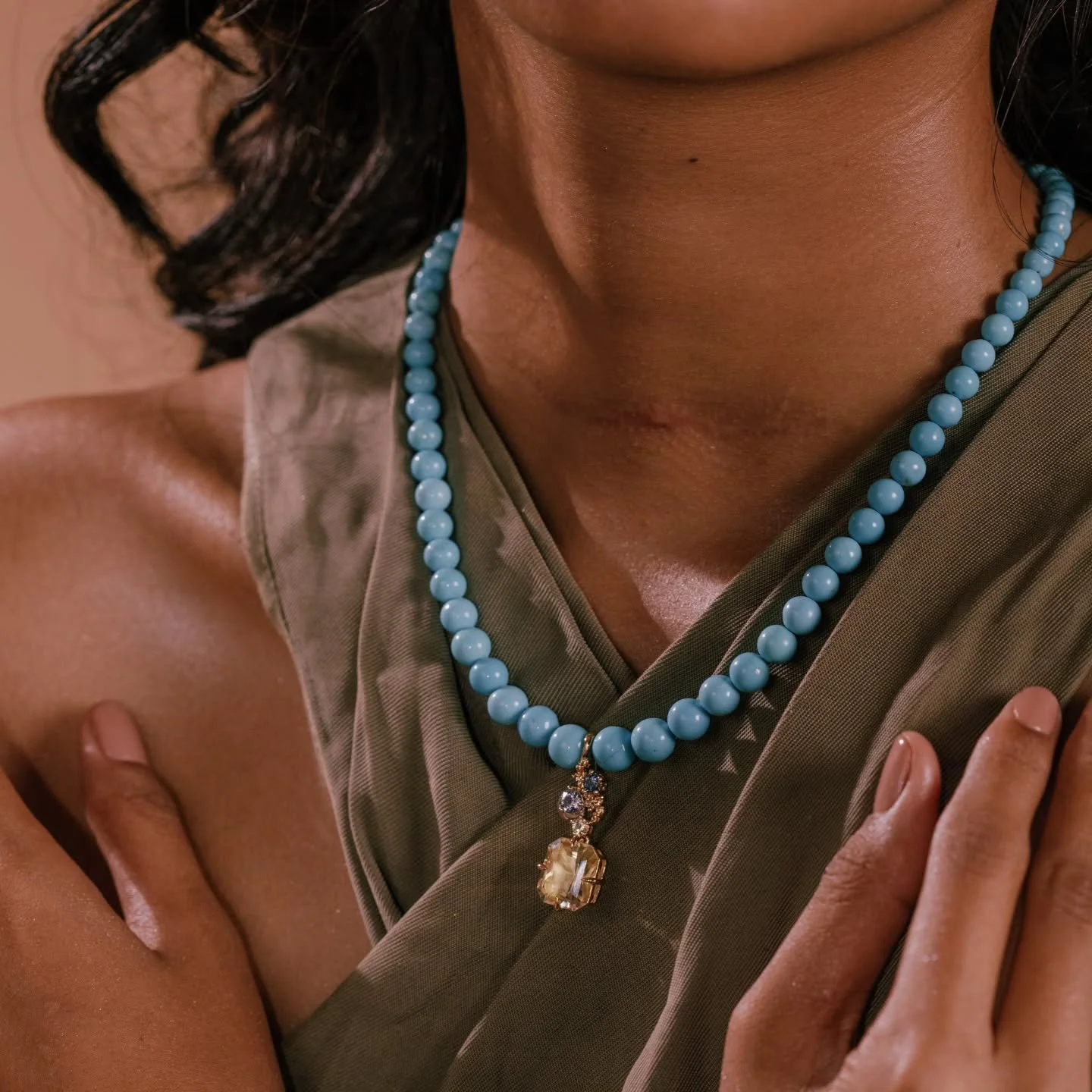 The Sky and the Sun.

Featured: Our "Sunshine Frolic" Citrine and Sapphire Pendant (The pendant is clasped unto a luxurious Sleeping Beauty turquoise strand.)
5.62ct light yellow citrine from Sri Lanka, natural and untreated 0.24ct natural 