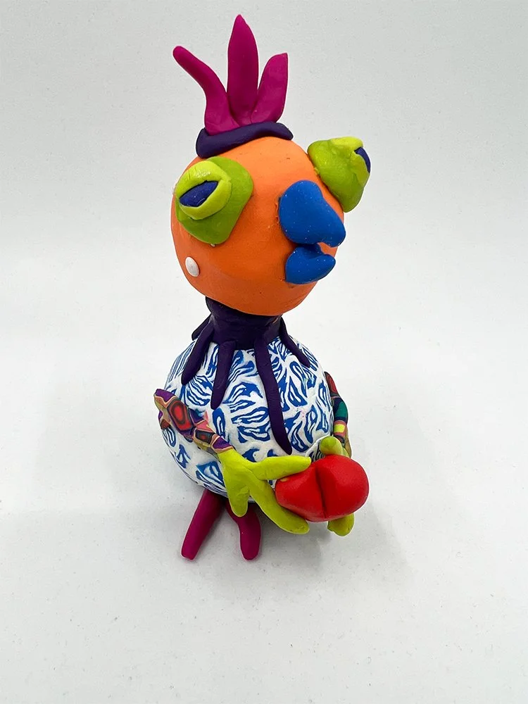 Green Eyed Bird with Red Heart