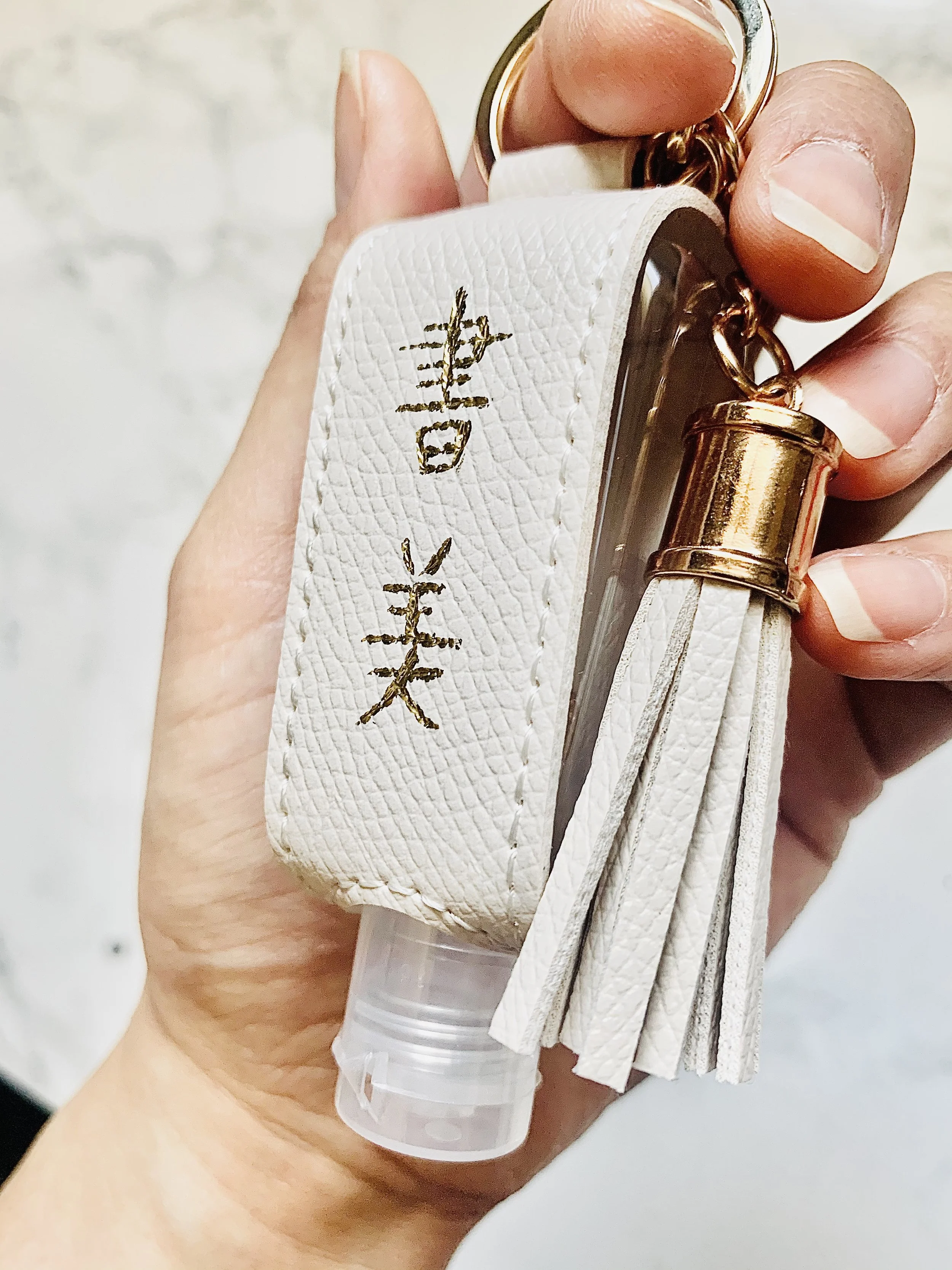 hot foiled chinese name on leather sanitizer keychain