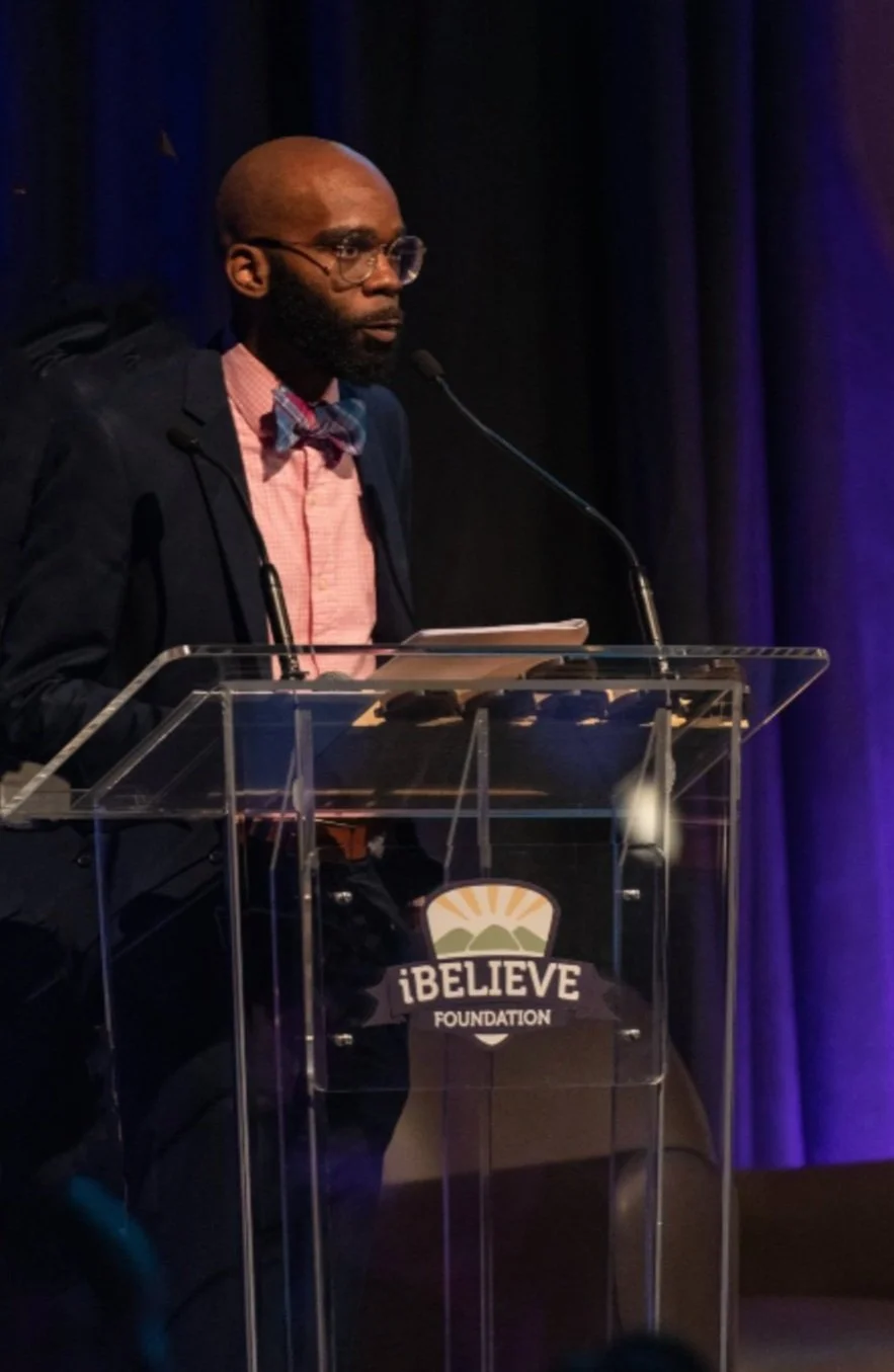 Dr. Haynes speaking at a podium