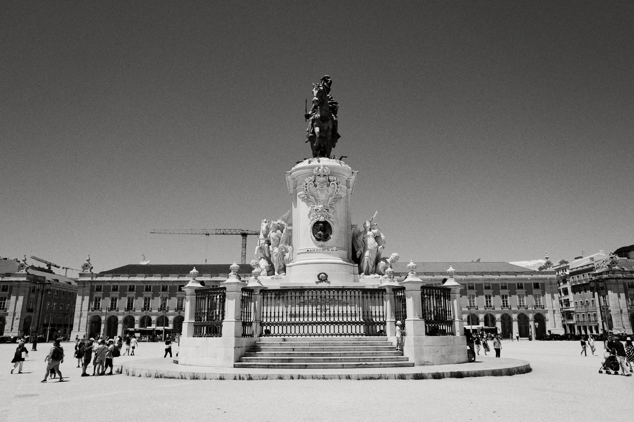 Black-and-white Leica street photo from Interwoven Cities by John Hendrick—urban life in contrast.