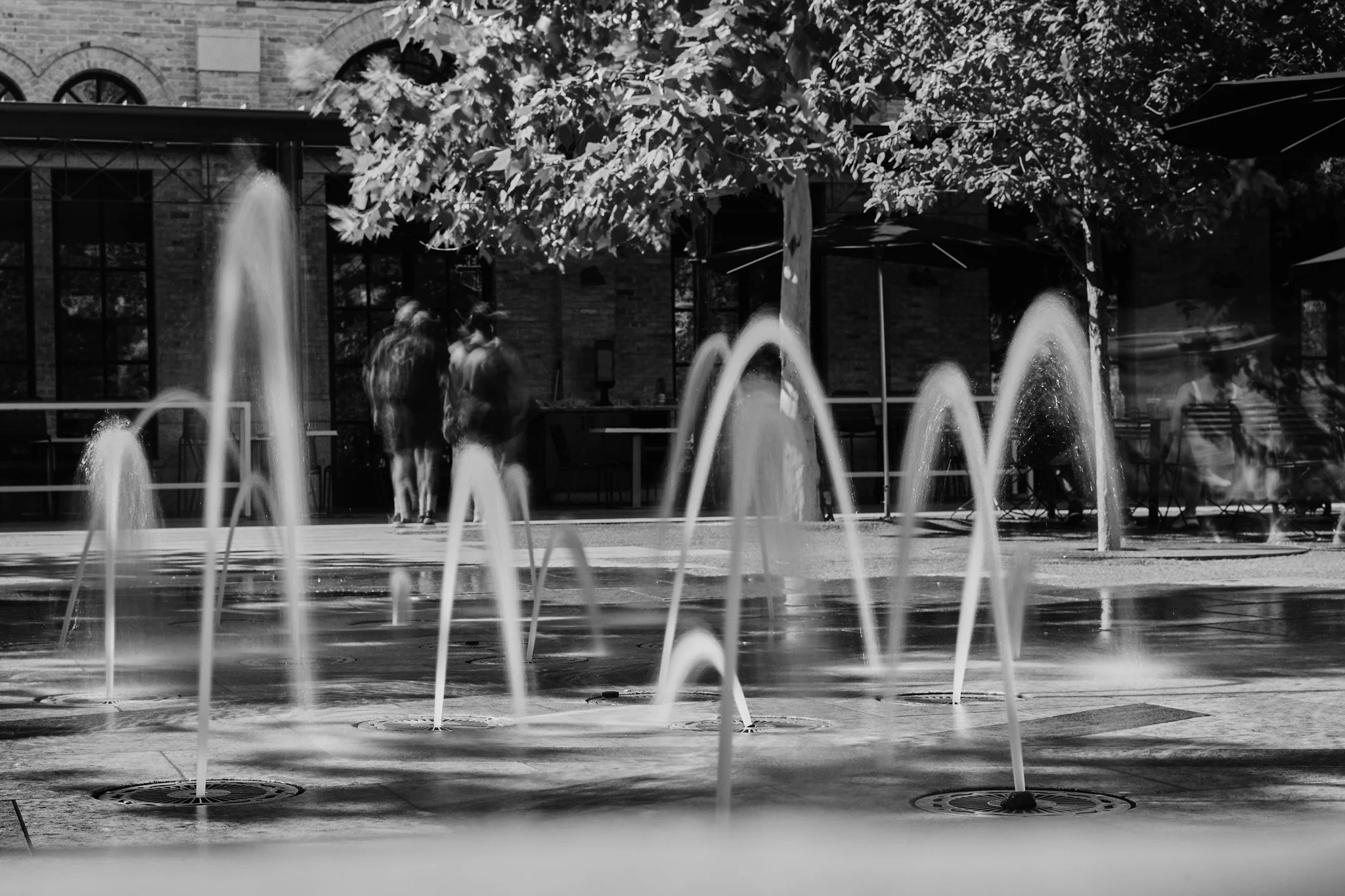 Leica street photography series by San Antonio-based photographer John Hendrick. Captured over six years using the Leica M240, M246 Monochrom, Q-P, and SL with Leica M lenses including the 50mm Summicron, 35mm Summilux, 90mm Summicron, and 28mm Elmar