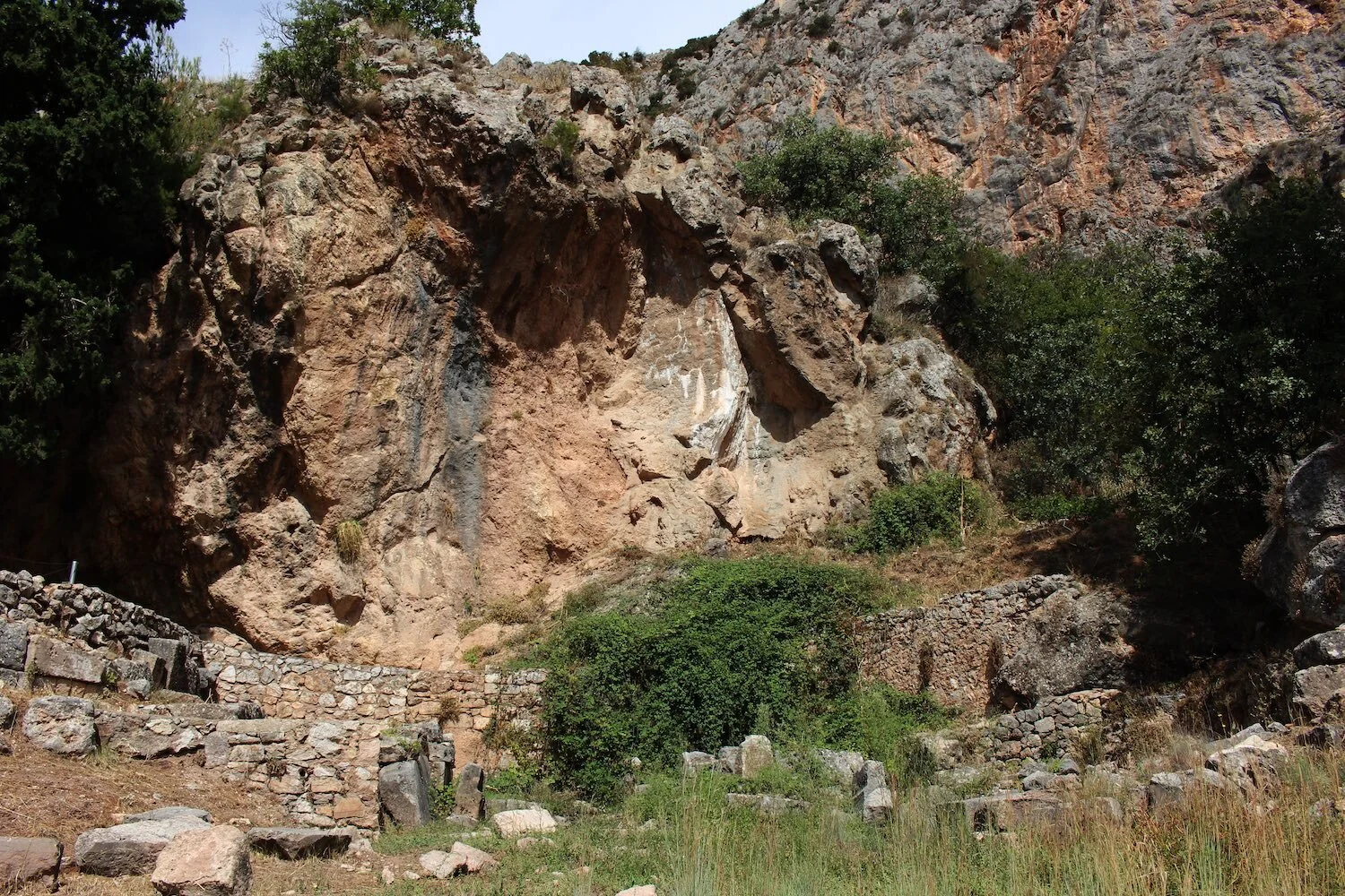 A photograph of the rock face at the sacred site of Delphi.