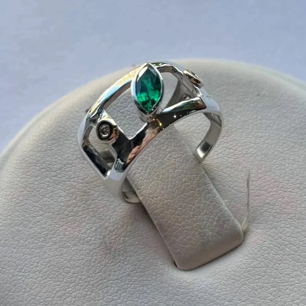 Imitation emerald set in sterling silver, diamond melee bezel-set in 14K yellow gold 