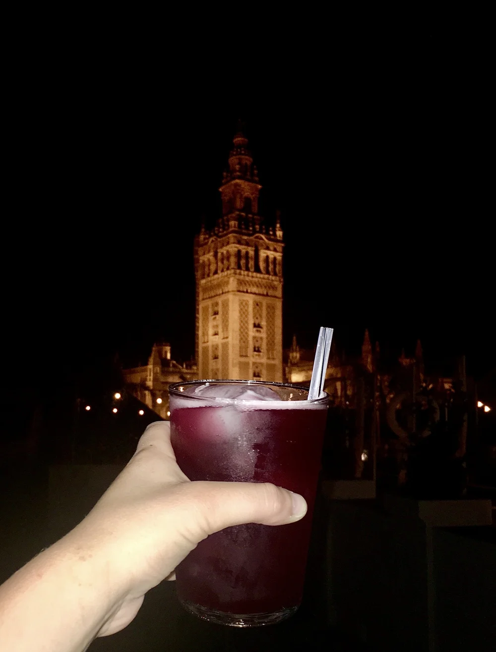  Tinto de Verano is one of Spain's famous summer drinks (red wine mixed with lemonade)! You're also getting a nighttime view of La Giralda, the Sevilla Cathedral's bell tower. 