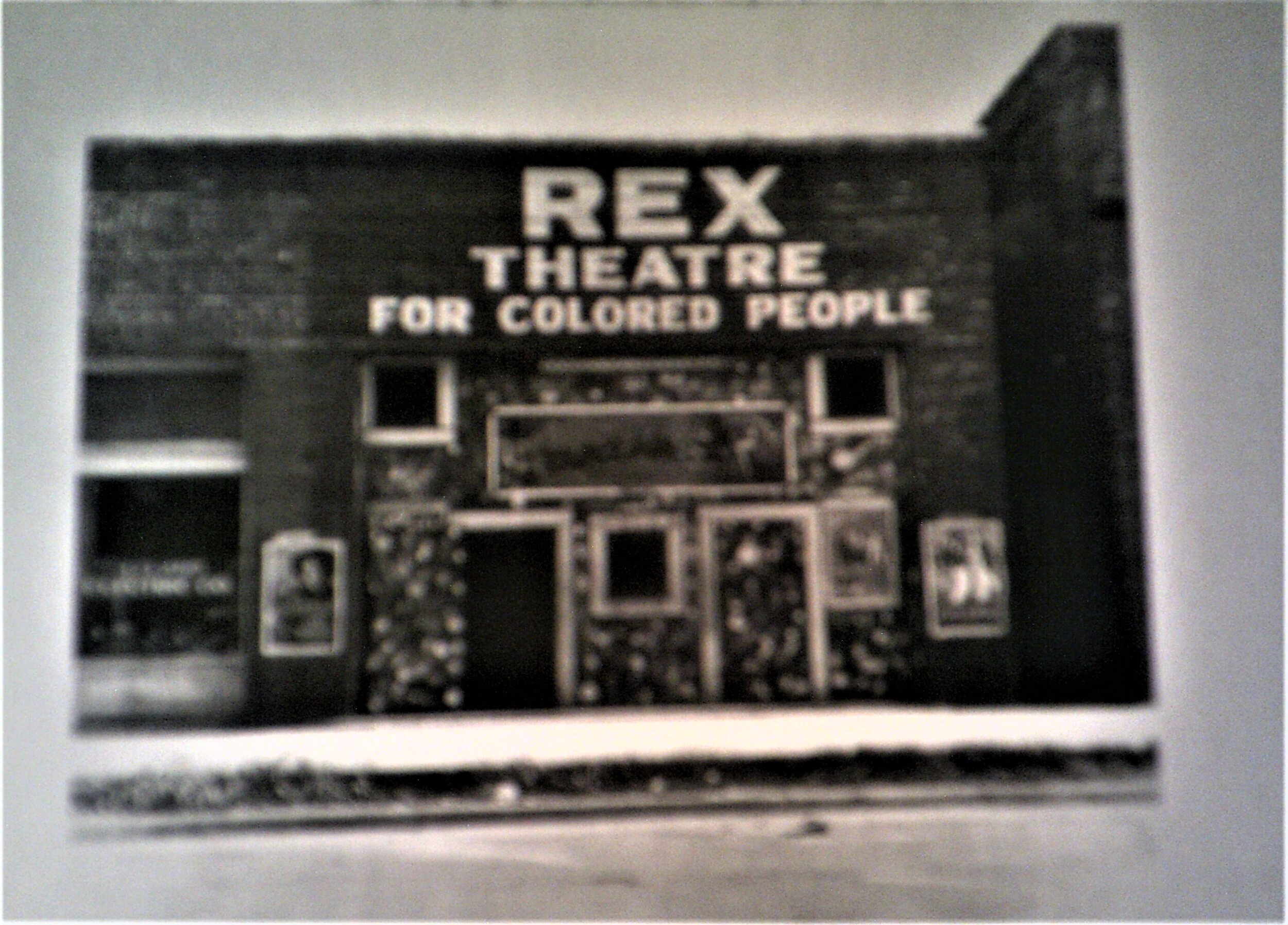 Exhibit 85 - Segregation laws were strictly followed in the city of Birmingham until the 1960s civil rights activities in Alabama. The Rex Theatre in MS. 1937, shows how widespread segregation was in the South..JPG