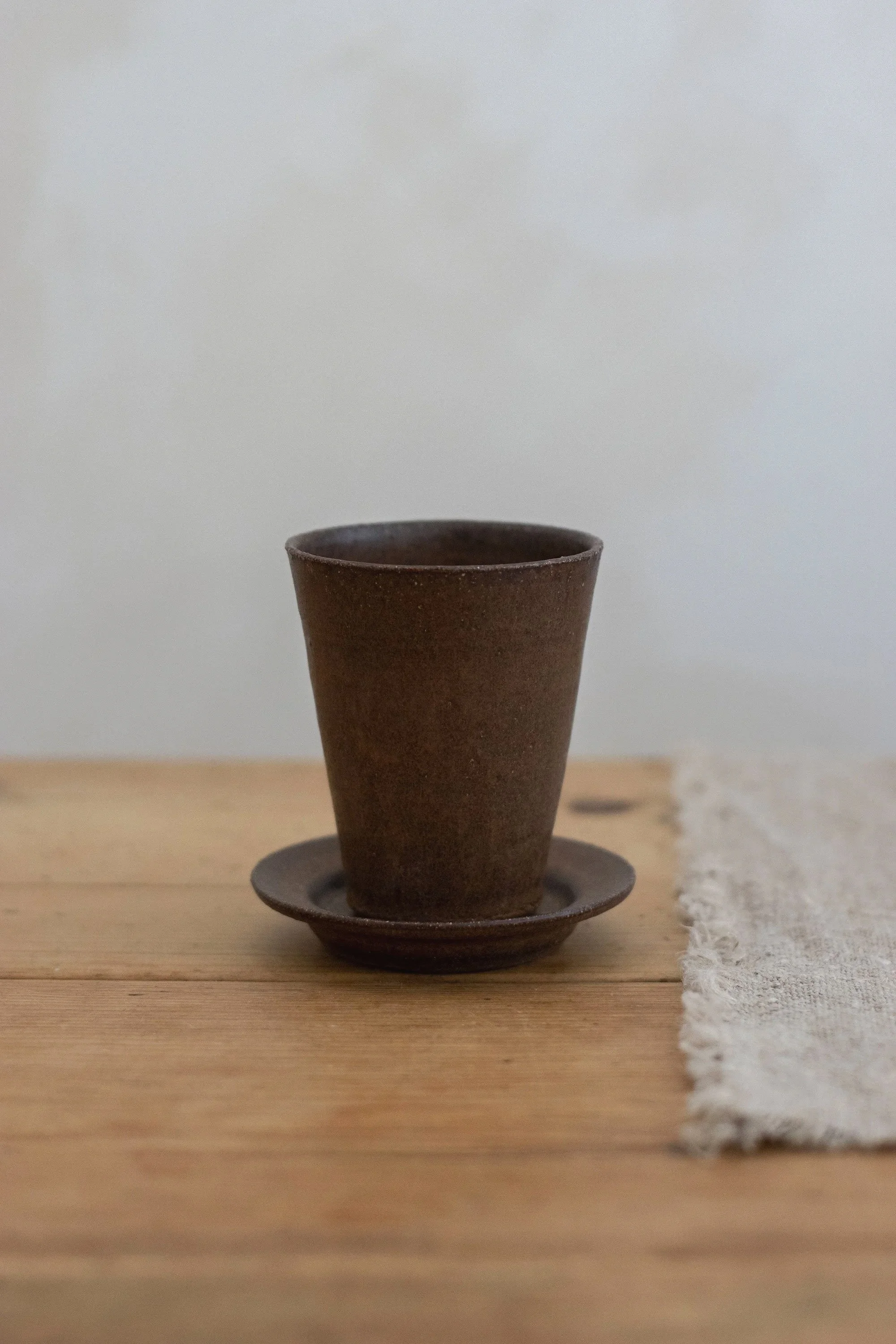 Tall cup and saucer in bark