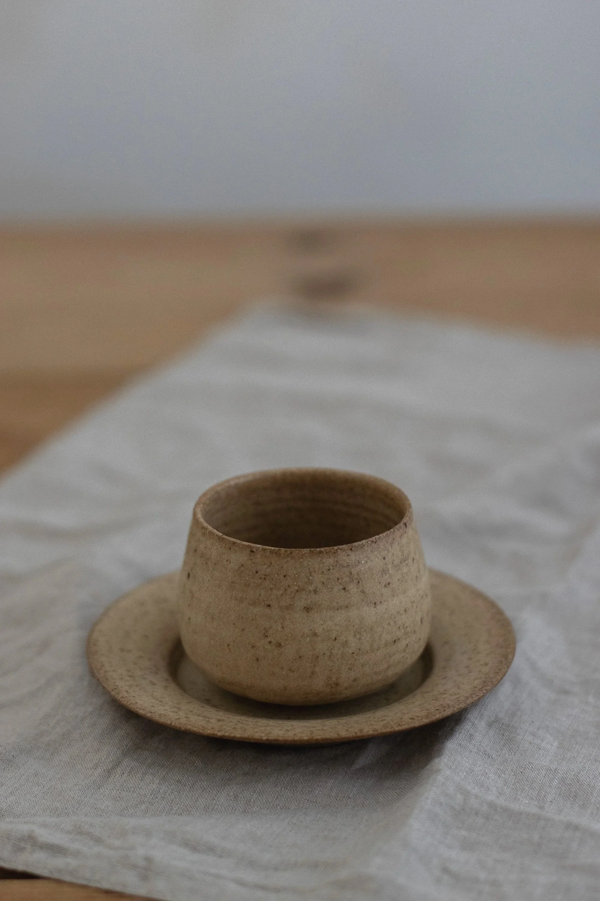 Cup and saucer in hay