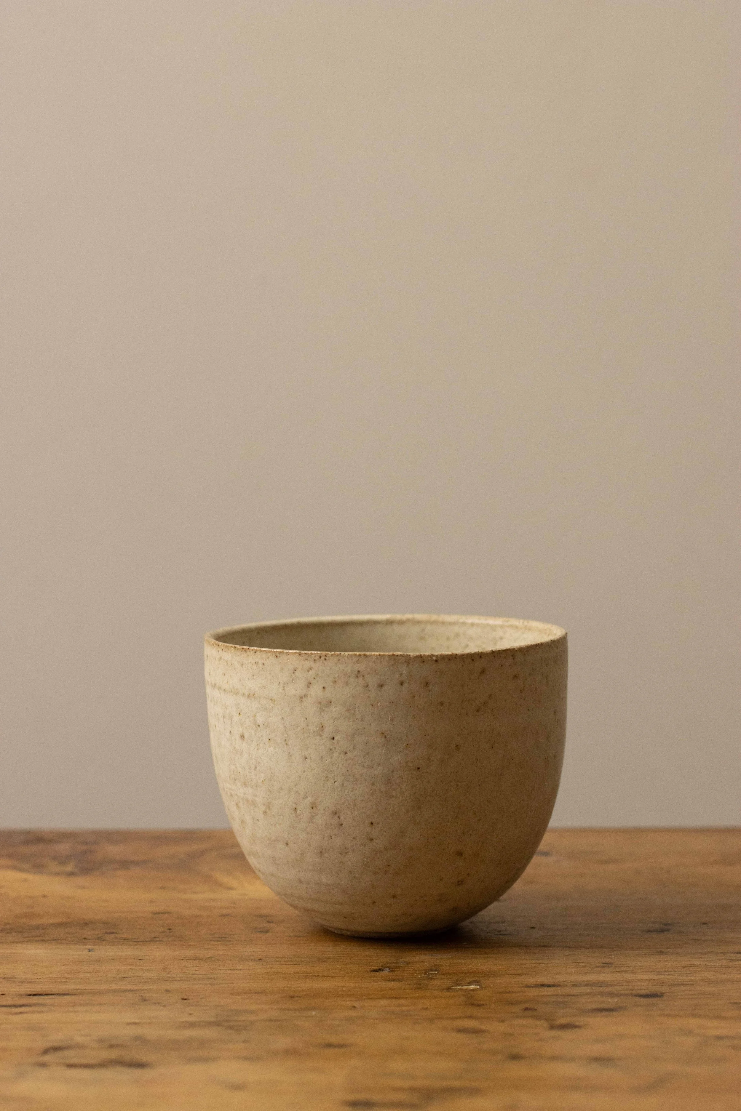Curved cup in stone