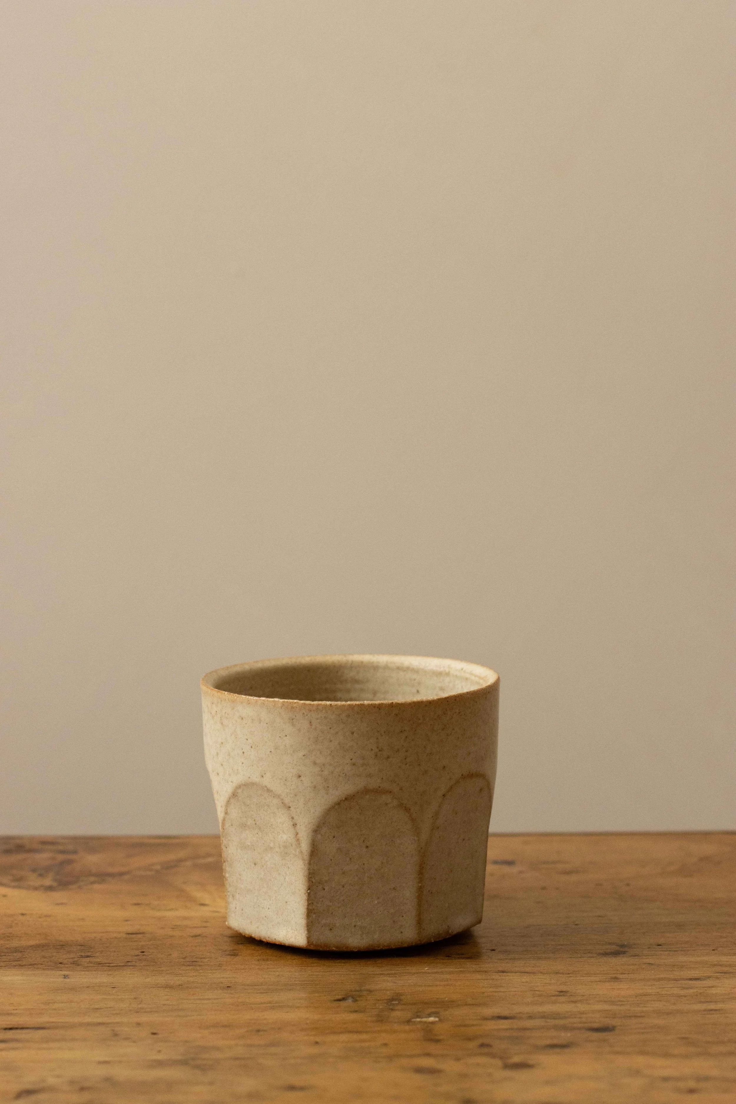 Faceted cup in stone