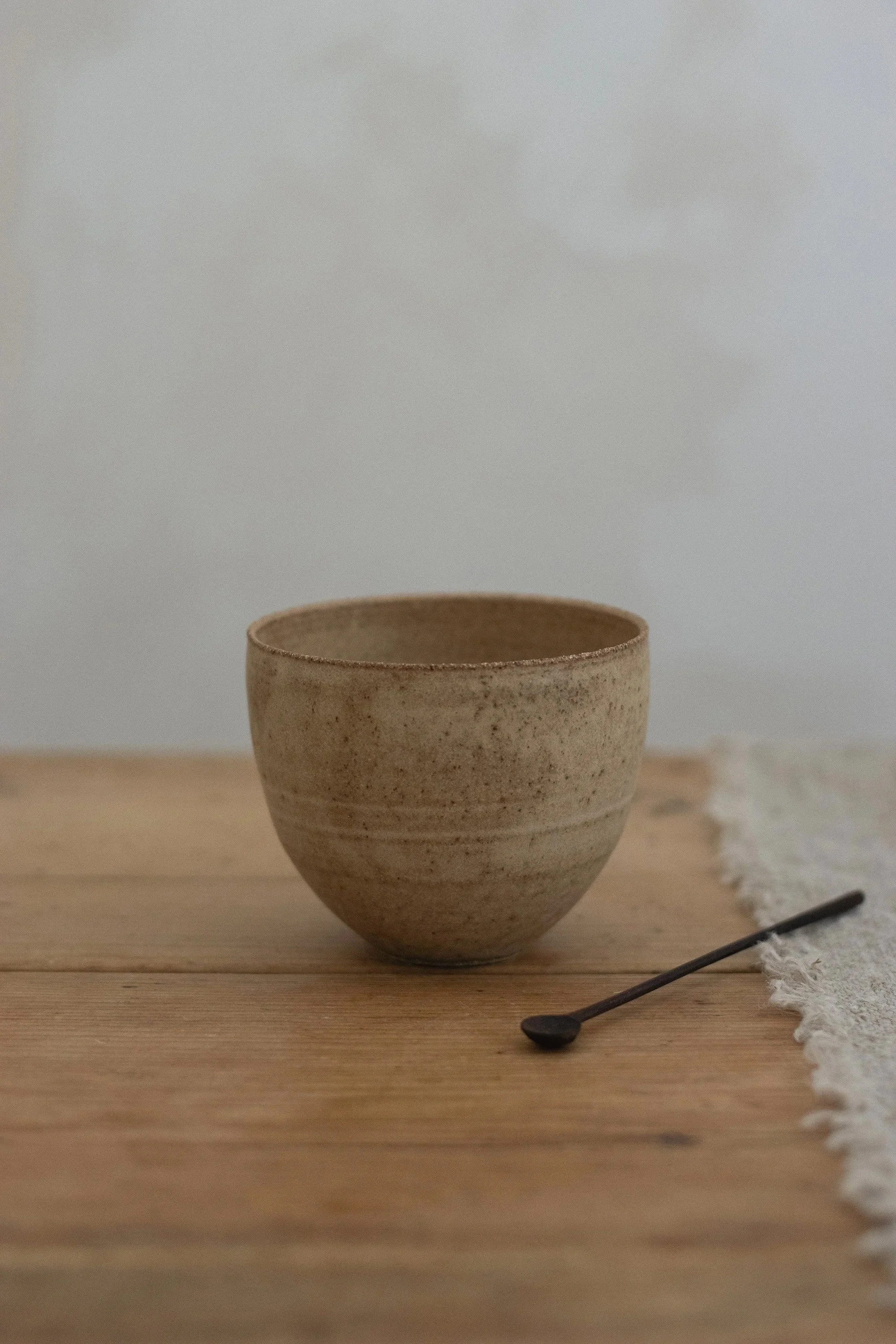 Curved cup in hay