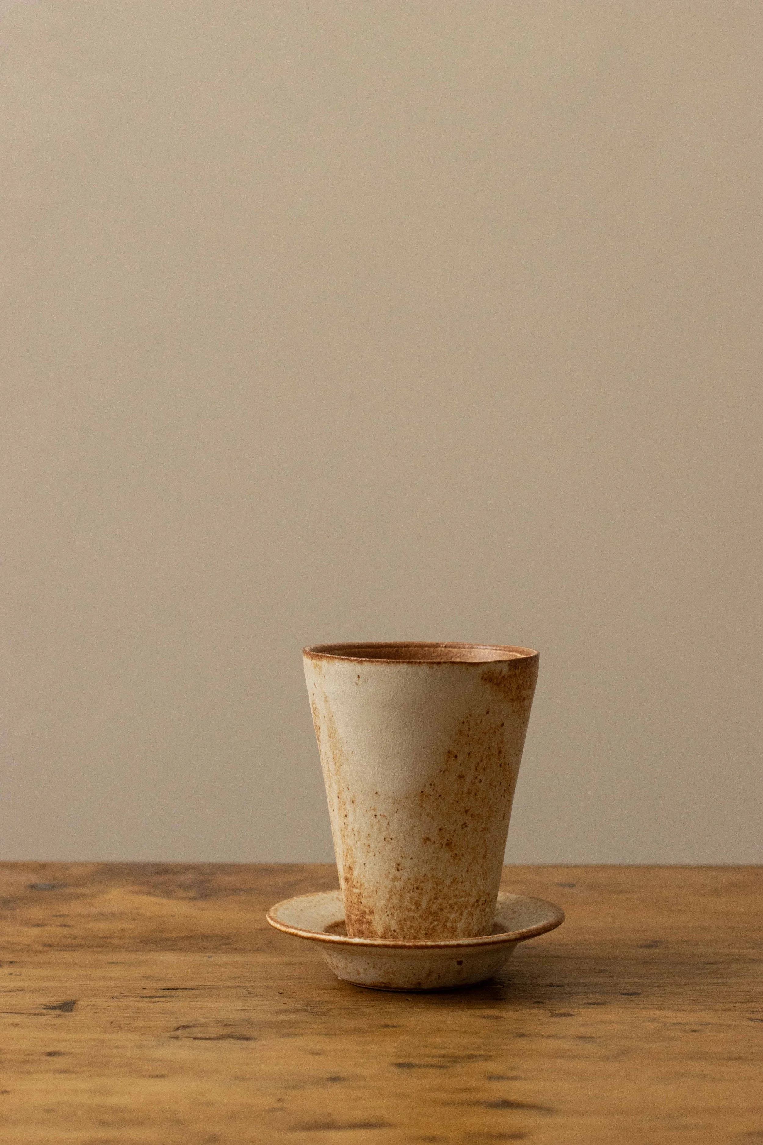 Tall cup and saucer in cinnamon