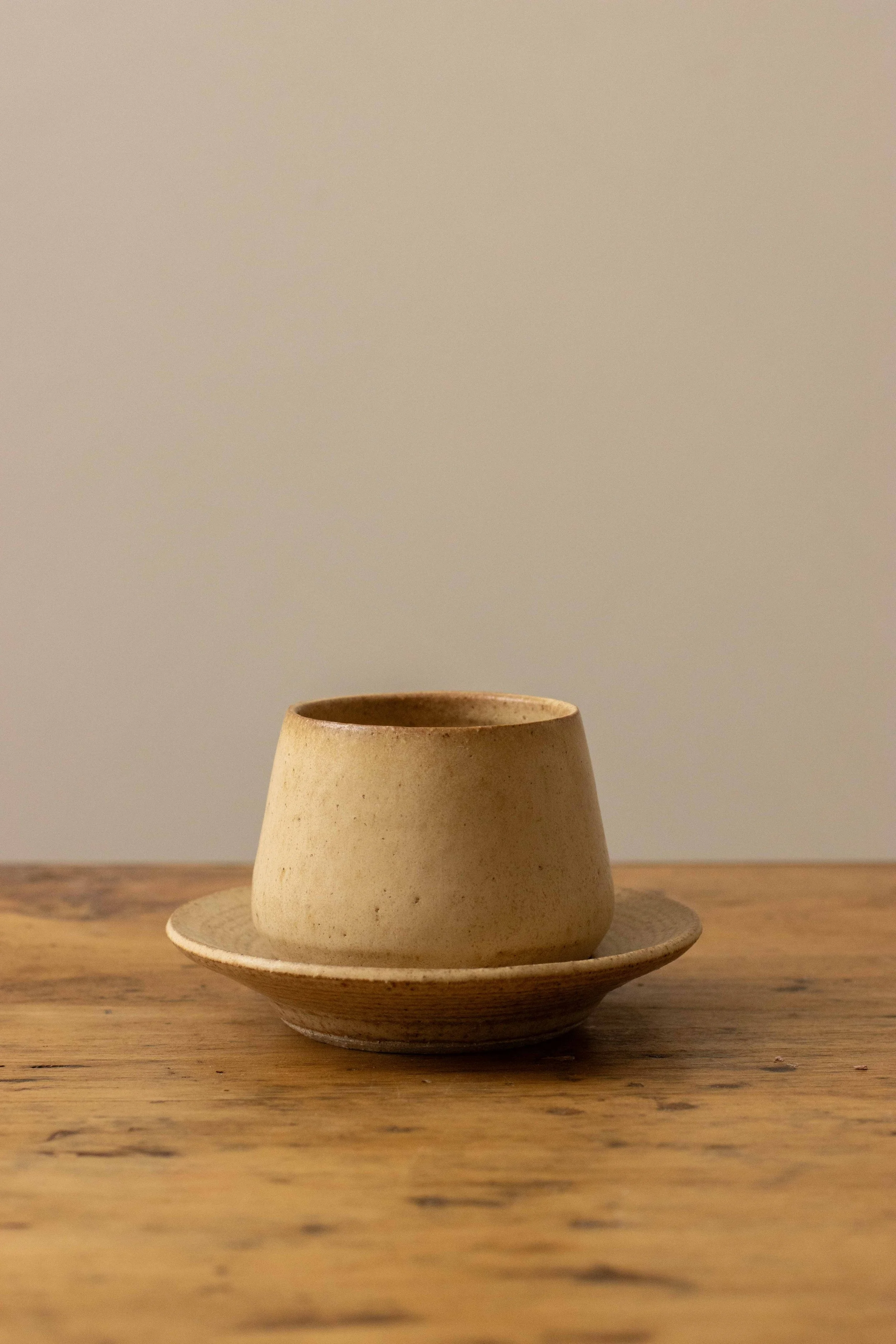Cup and saucer in hay