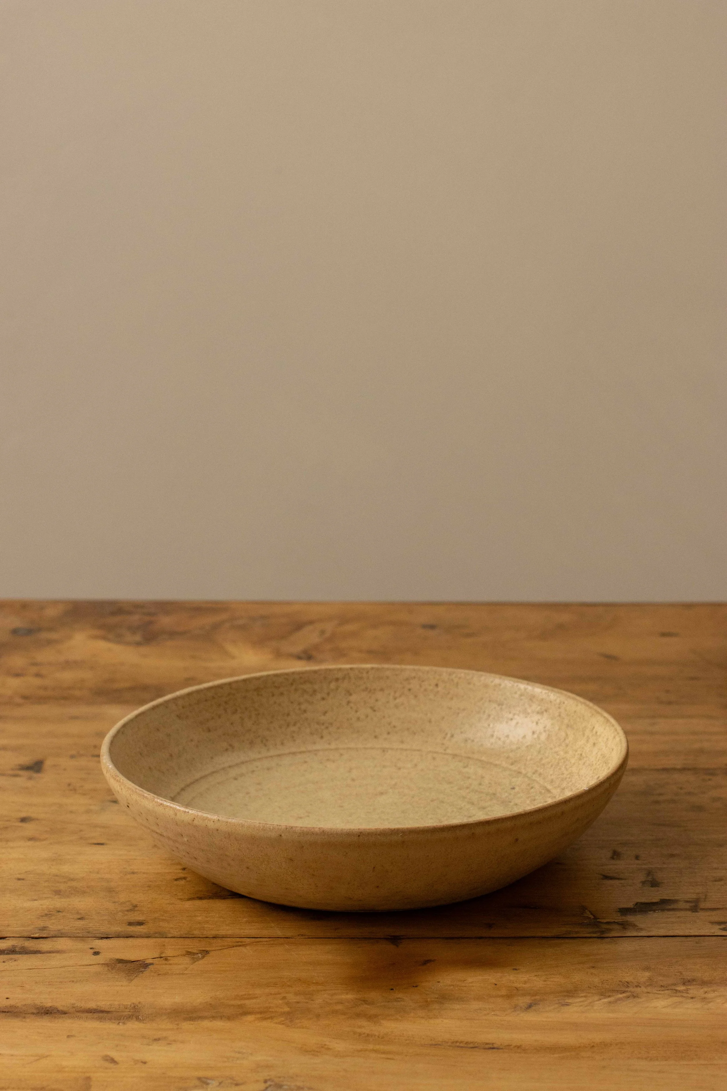 Shallow bowl in hay