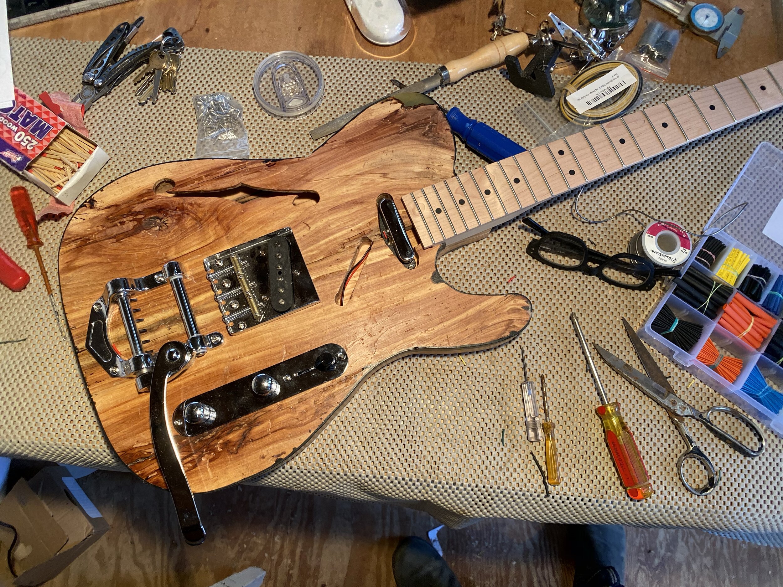 Bolting on the hardware, and soldering the electronics ▸