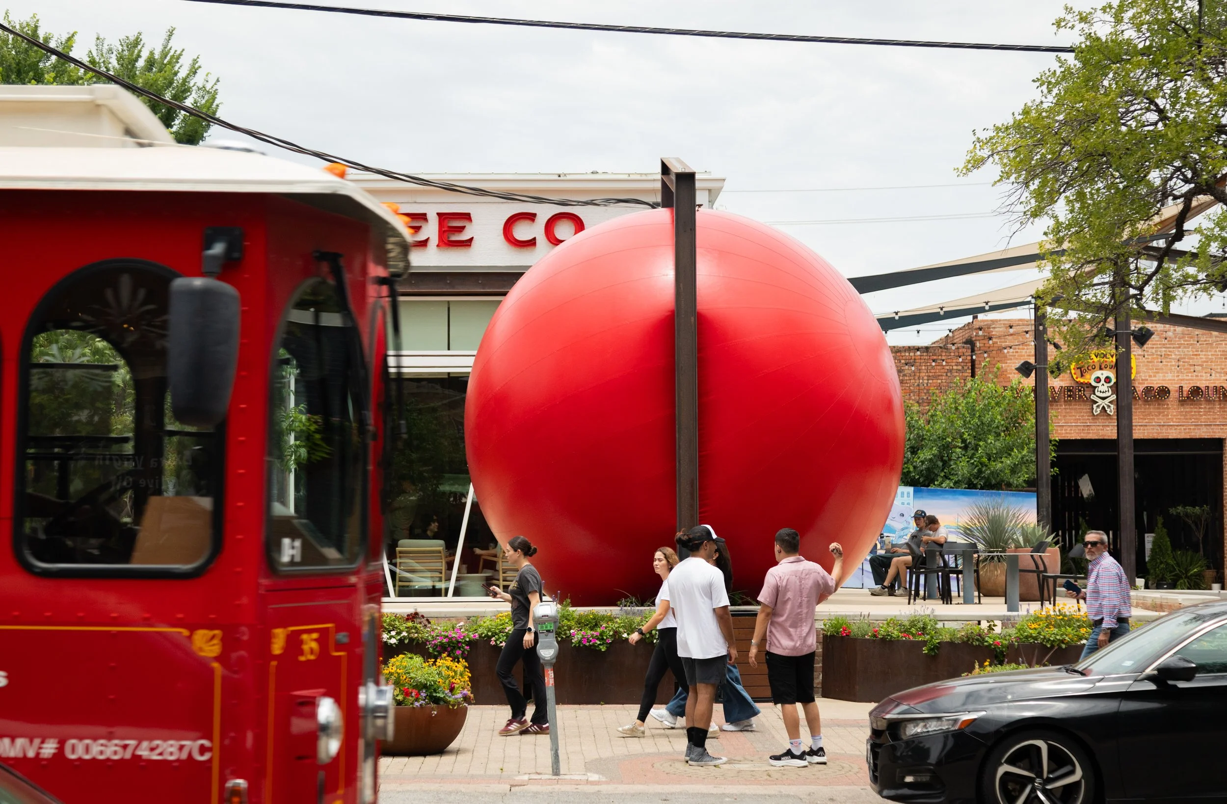 Deep Ellum Dallas RedBall Project in front of Merit Coffee Co