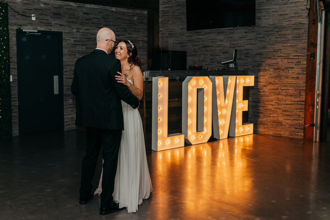 Couple dancing indoors at Humble Beginnings Event Venue Ontario.