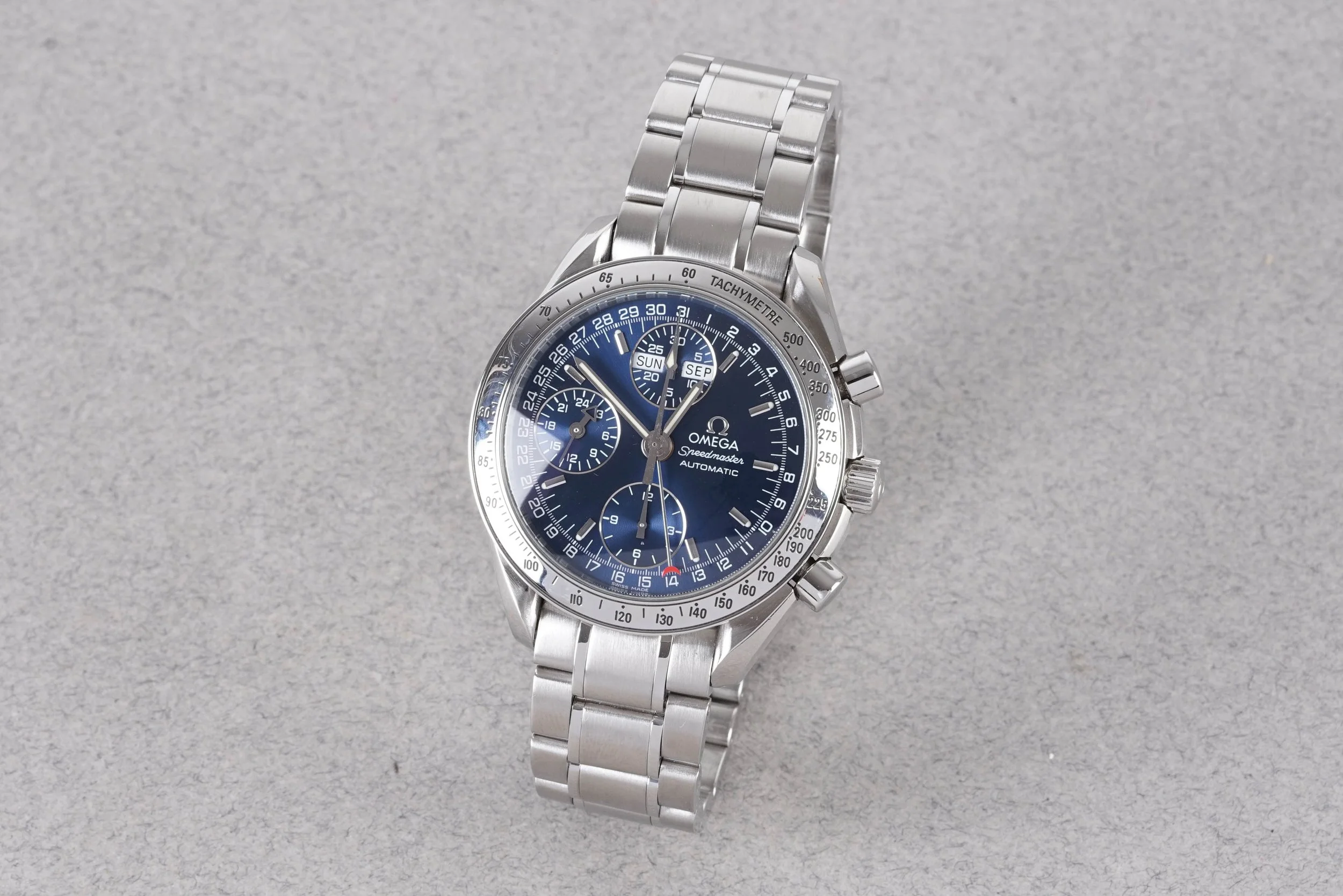 OMEGA SPEEDMASTER DAY DATE CALENDAR AUTOMATIC CHRONOGRAPH W/ GUARANTEE CARD REF. 35238000