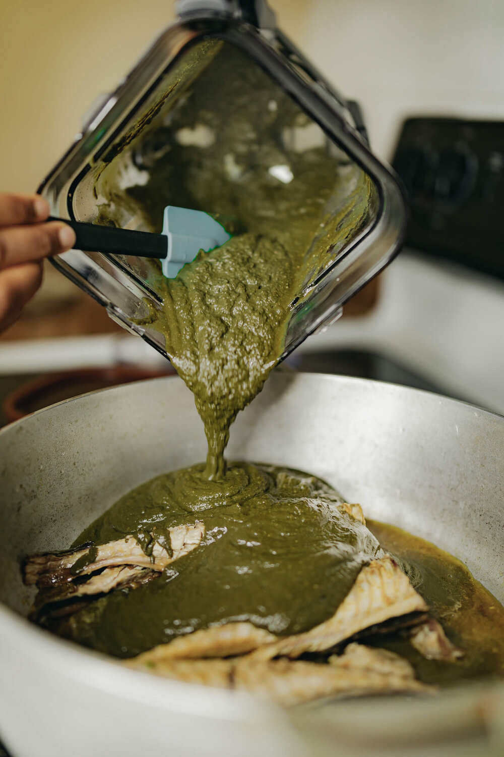 Pour cocoyam leaf mixture into pot. 