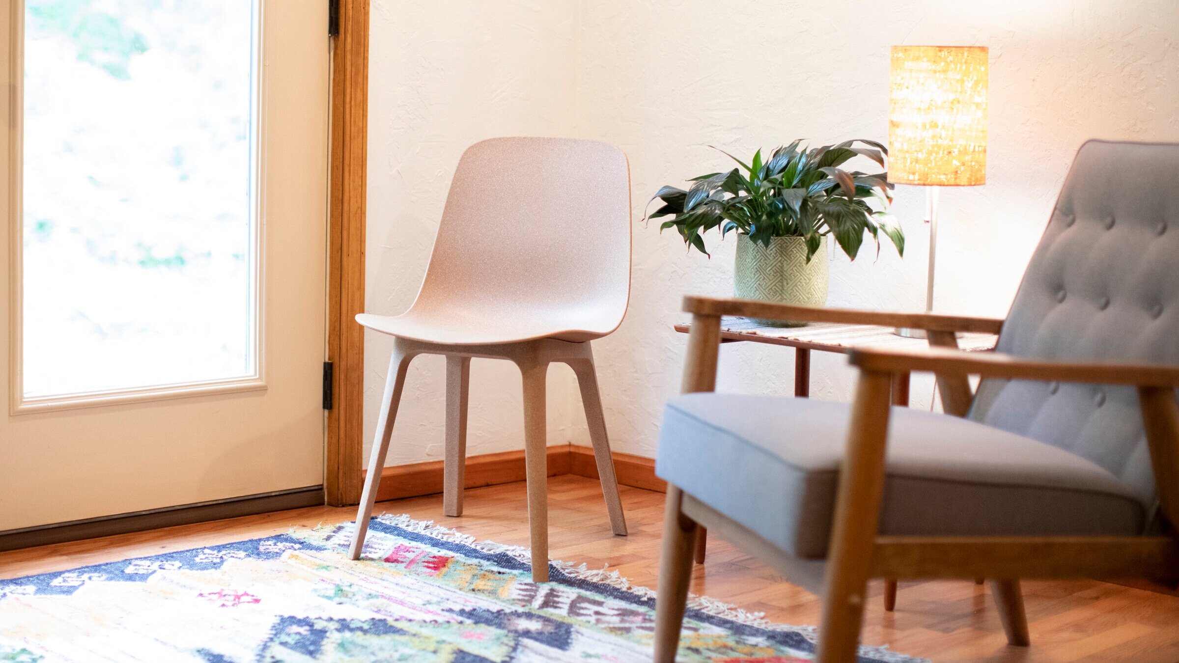  Photo of chairs and a plant in one of Julie’s patient rooms in her clinic. 