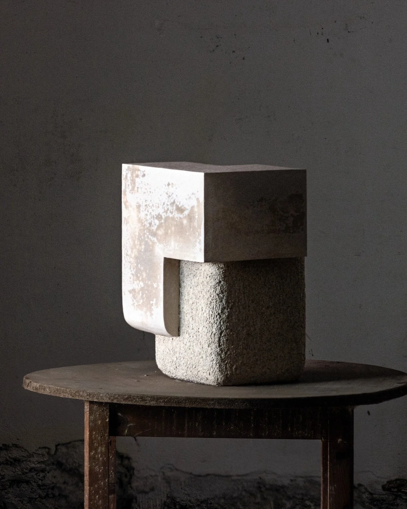 Coalescence sculpture by Marek Cwiek at Studiotwentyseven Gallery, Tribeca. A wabi-sabi sculpture with textures echoing stone blocks and ancient foundations, perfect for luxurious lofts and private collections.