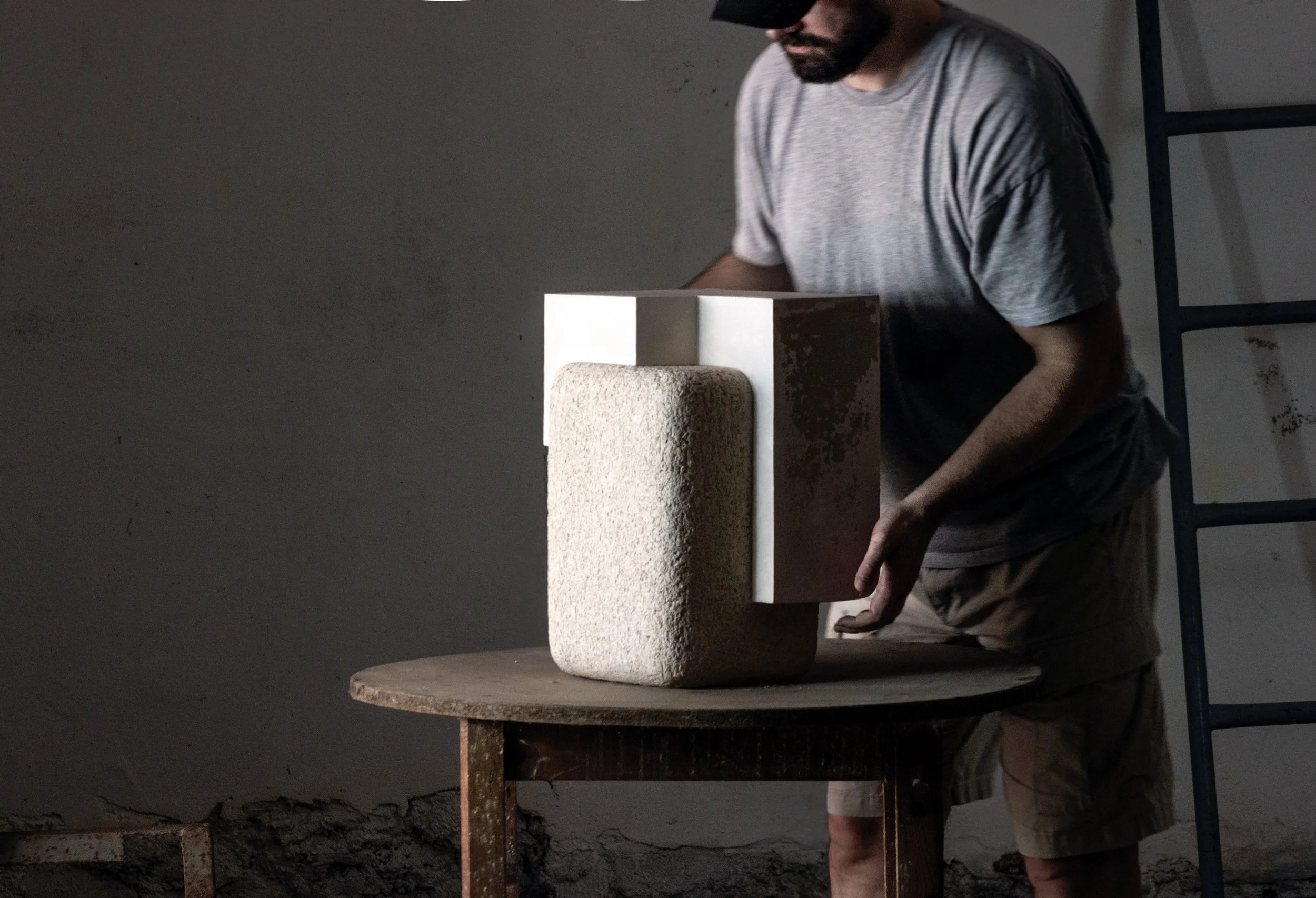 Polish artist Marek Cwiek creates modern art in stoneware, metal, and stone. Coalescence sculpture, exclusively at Studiotwentyseven Gallery, New York.