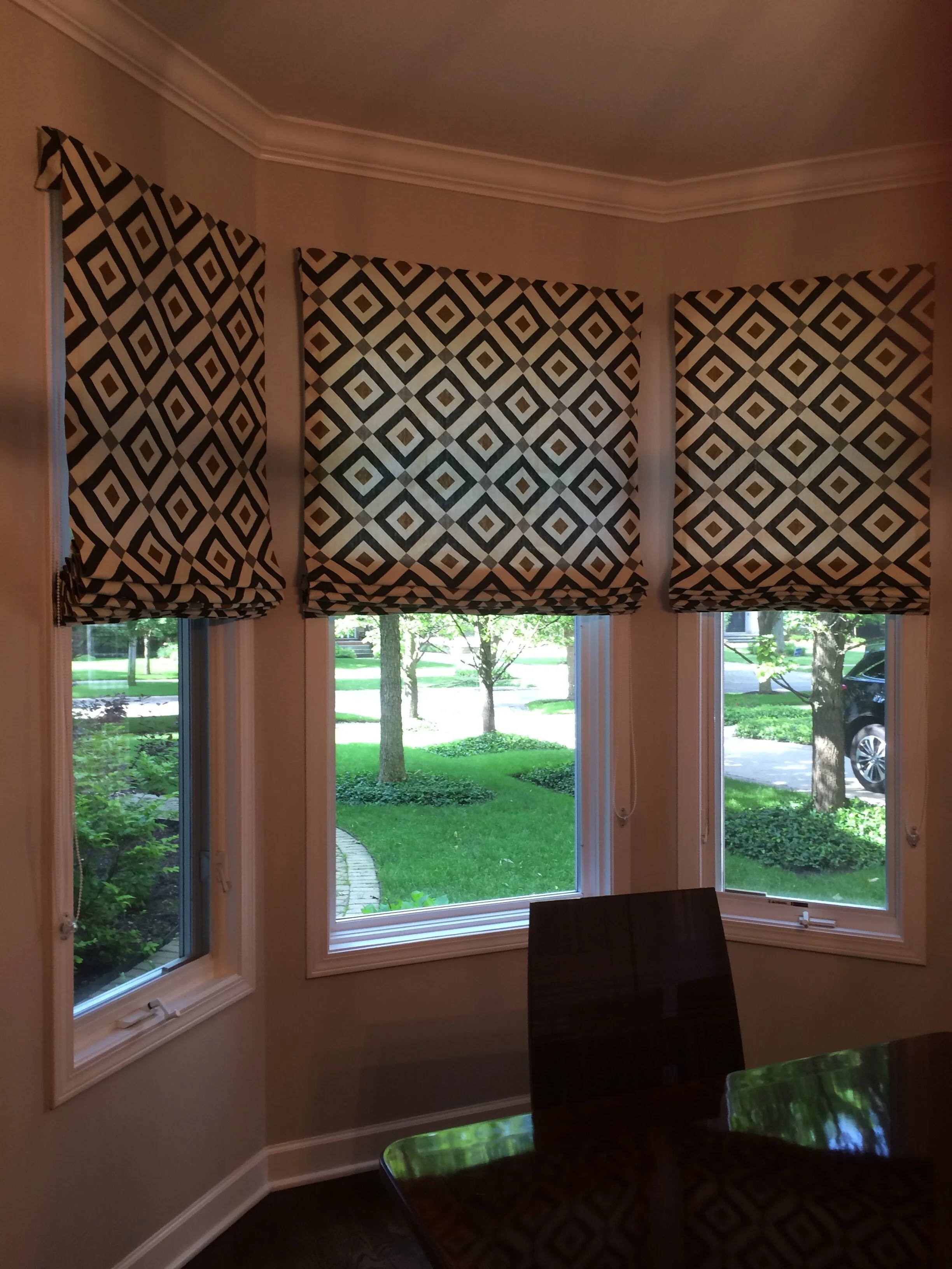 Flat Roman shades, outside mounted