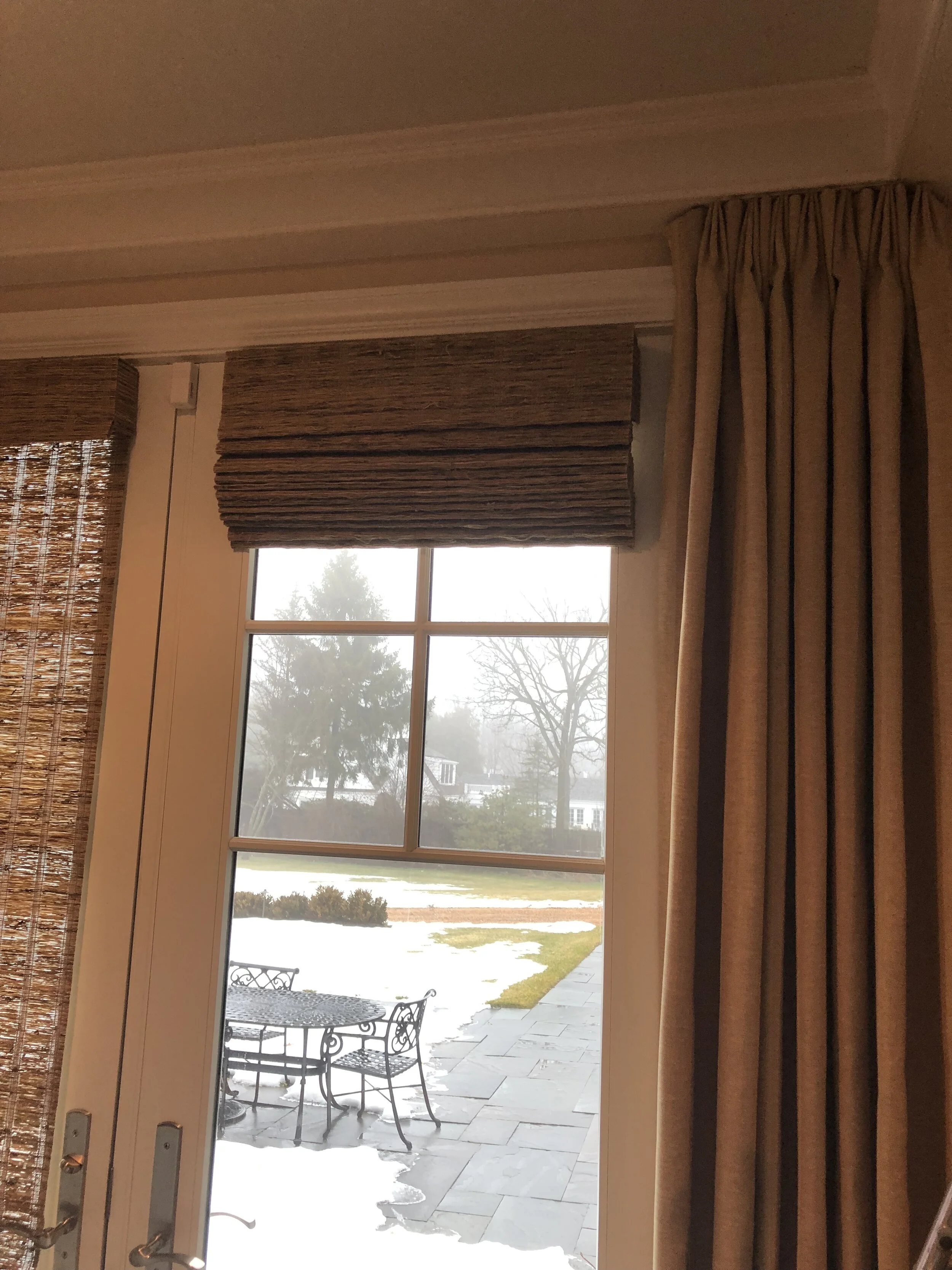 Stationary panels flanking French doors