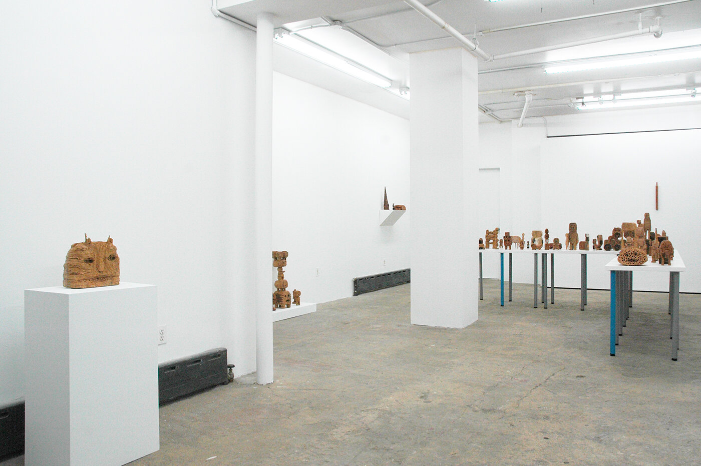 Installation image of sculptures by Hirosuke Yabe from his 2018 exhibition, Faithful Dog Man, at Cindy Rucker Gallery