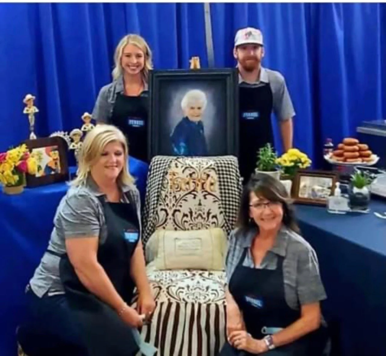 Third generation family members Taylor McPeak and Jonathan McKee with current owners Christi Erpillo and Johnna McKee and a photo of Fernie's Founder, Fernie Winter
