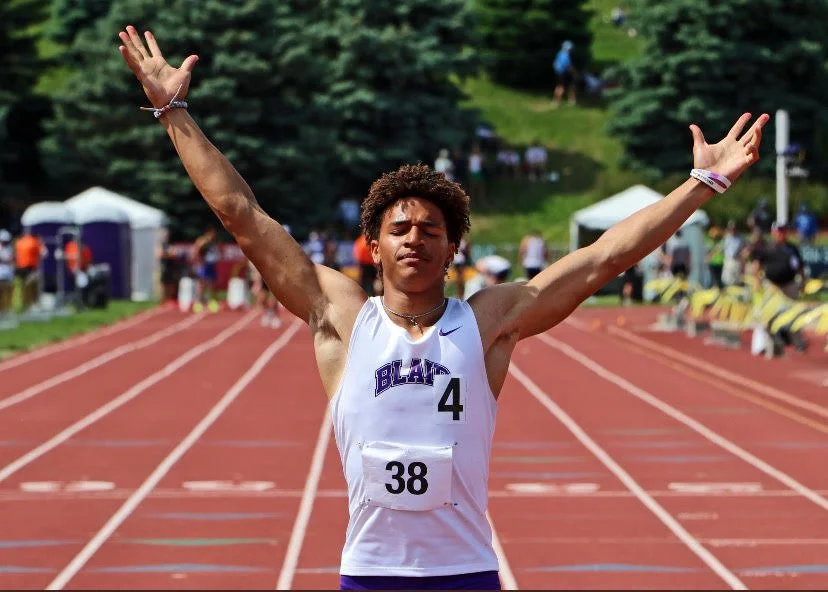 Ethan Baessler celebrating at the Nebraska state track meet
