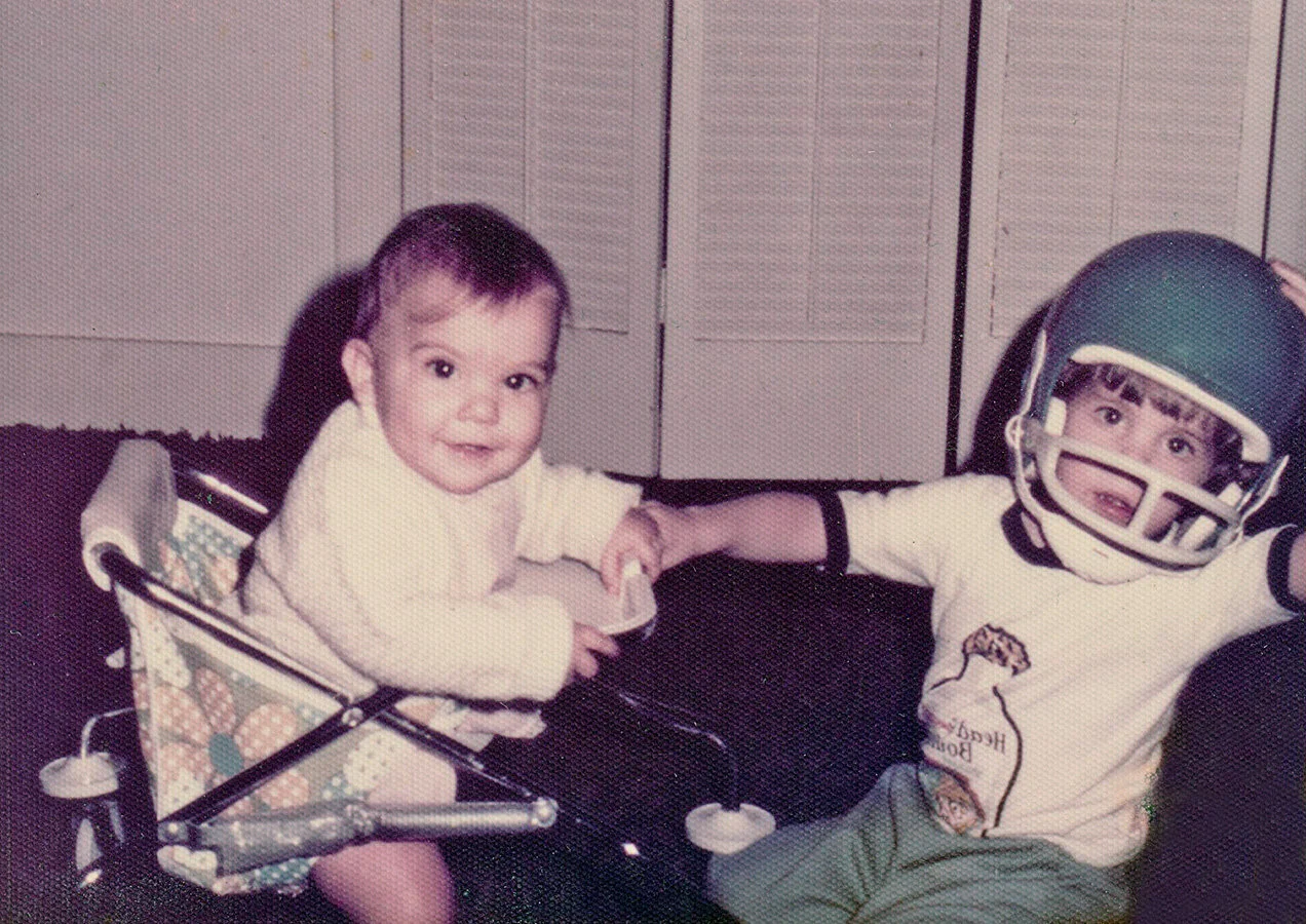 Todd playing football with his younger sister Tracy in 1975.