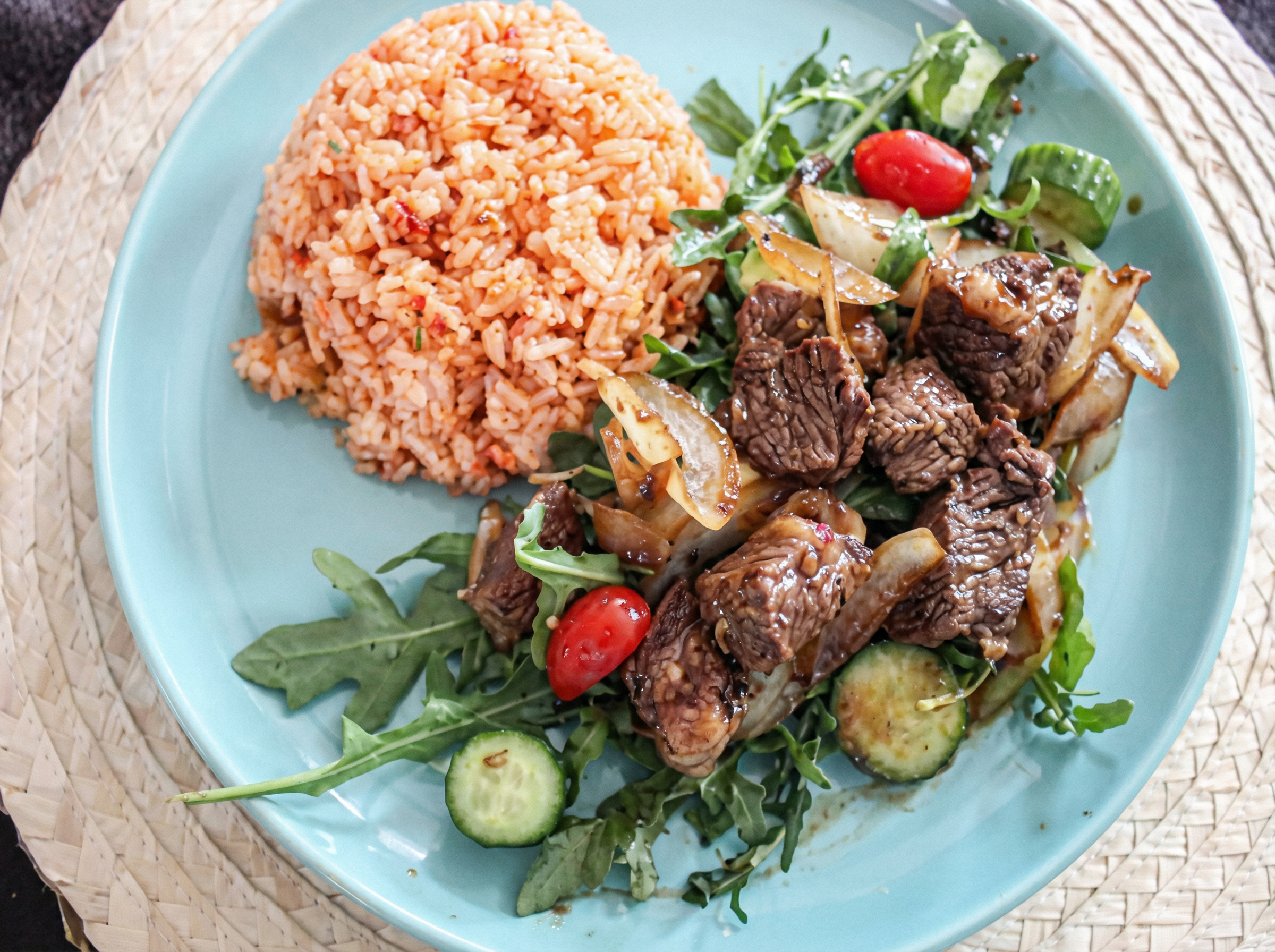 Bo luc lac, or shaking beef, features beef cubes seared quickly over high heat until glossy and caramelized.