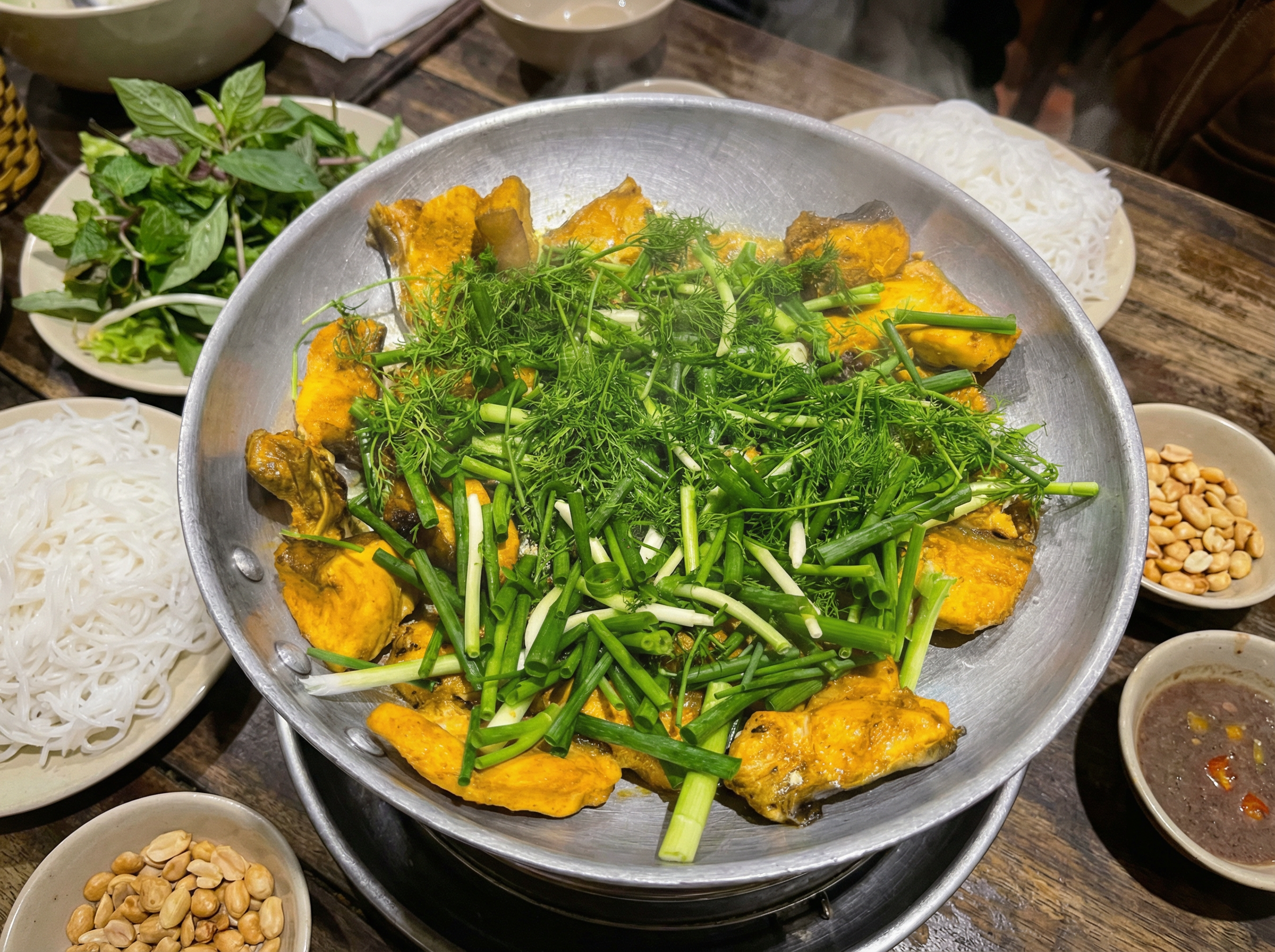 Cha ca is turmeric marinated fish cooked hot, traditionally served with dill and noodles.