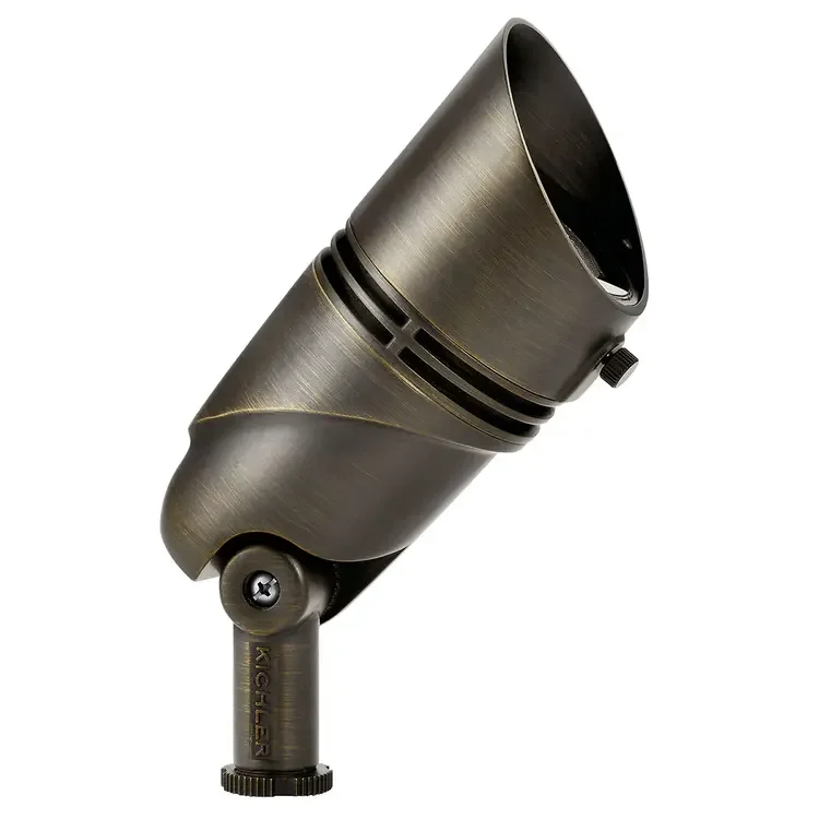 A metallic studio spotlight or stage light, angled upward, with adjustable mount.