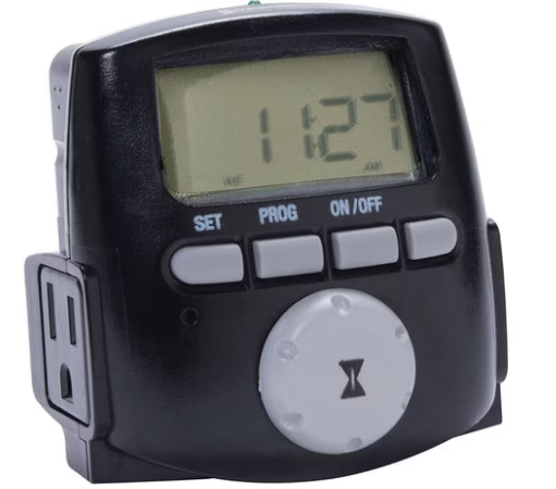 Digital timer set to 11:27 with three buttons labeled SET, PROG, and ON/OFF, and a large dial with an hourglass icon.