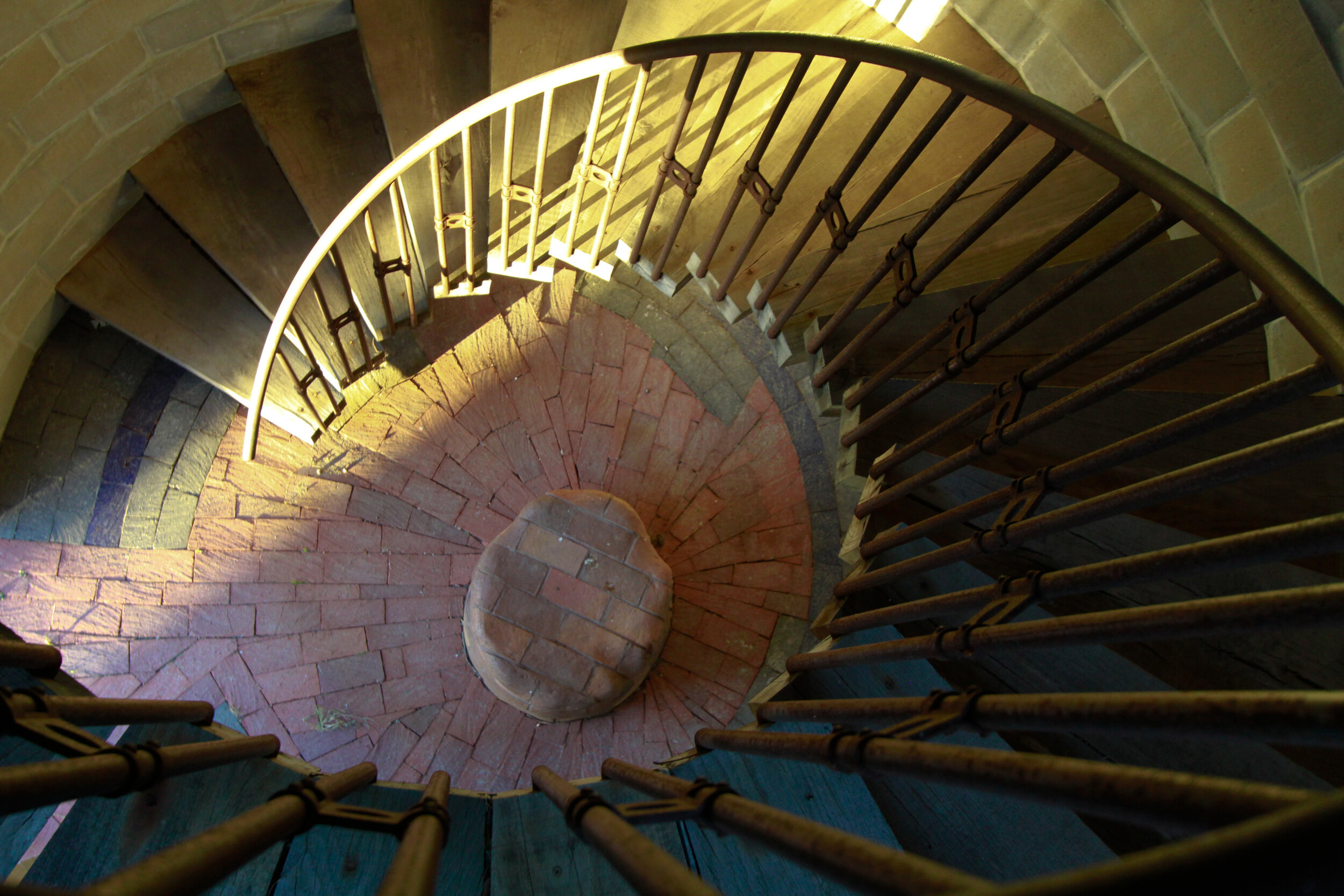 looking down the spiral staircase on interior of silo by Michael Morgan