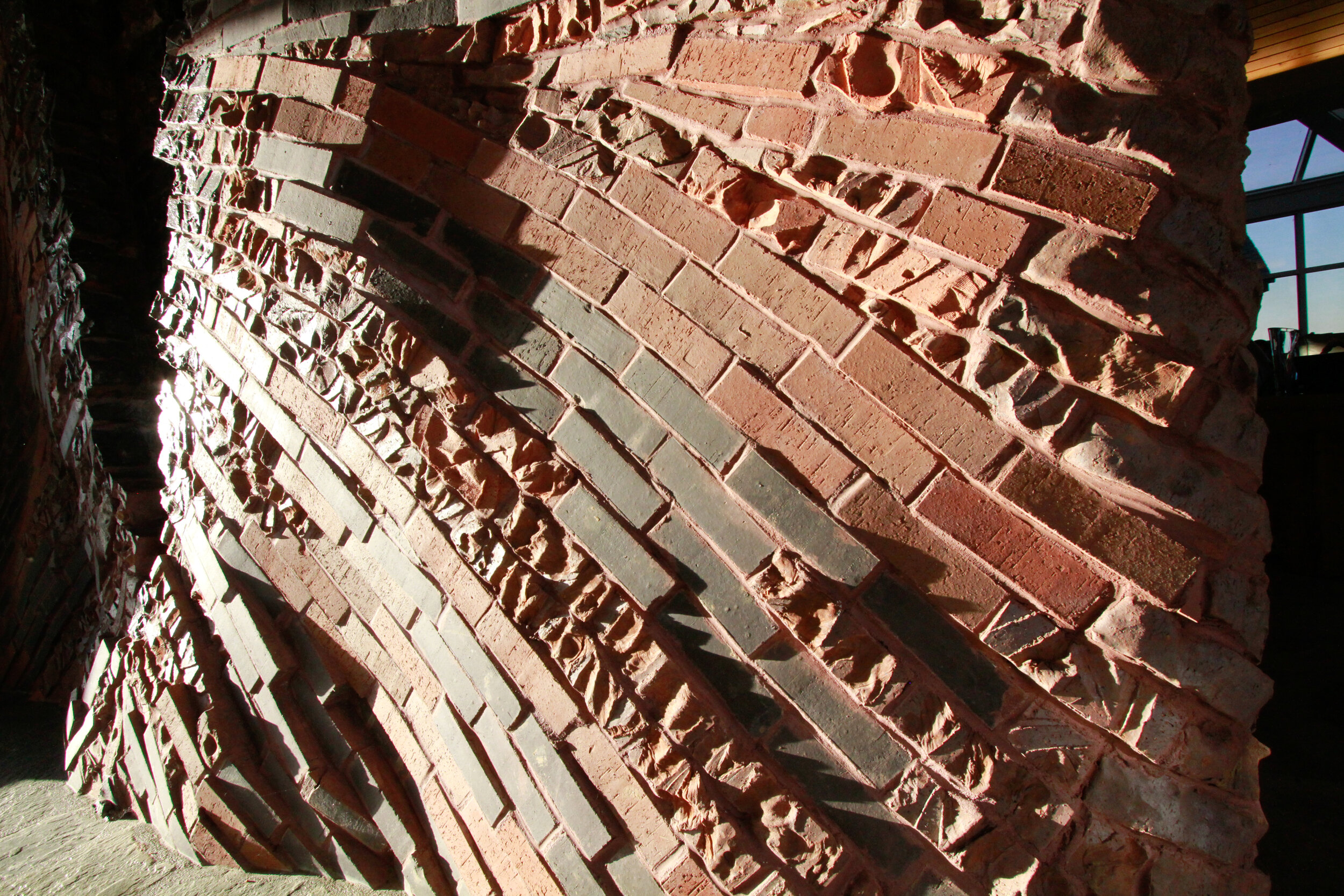 detailed closeup of carved brickwork wall fountain