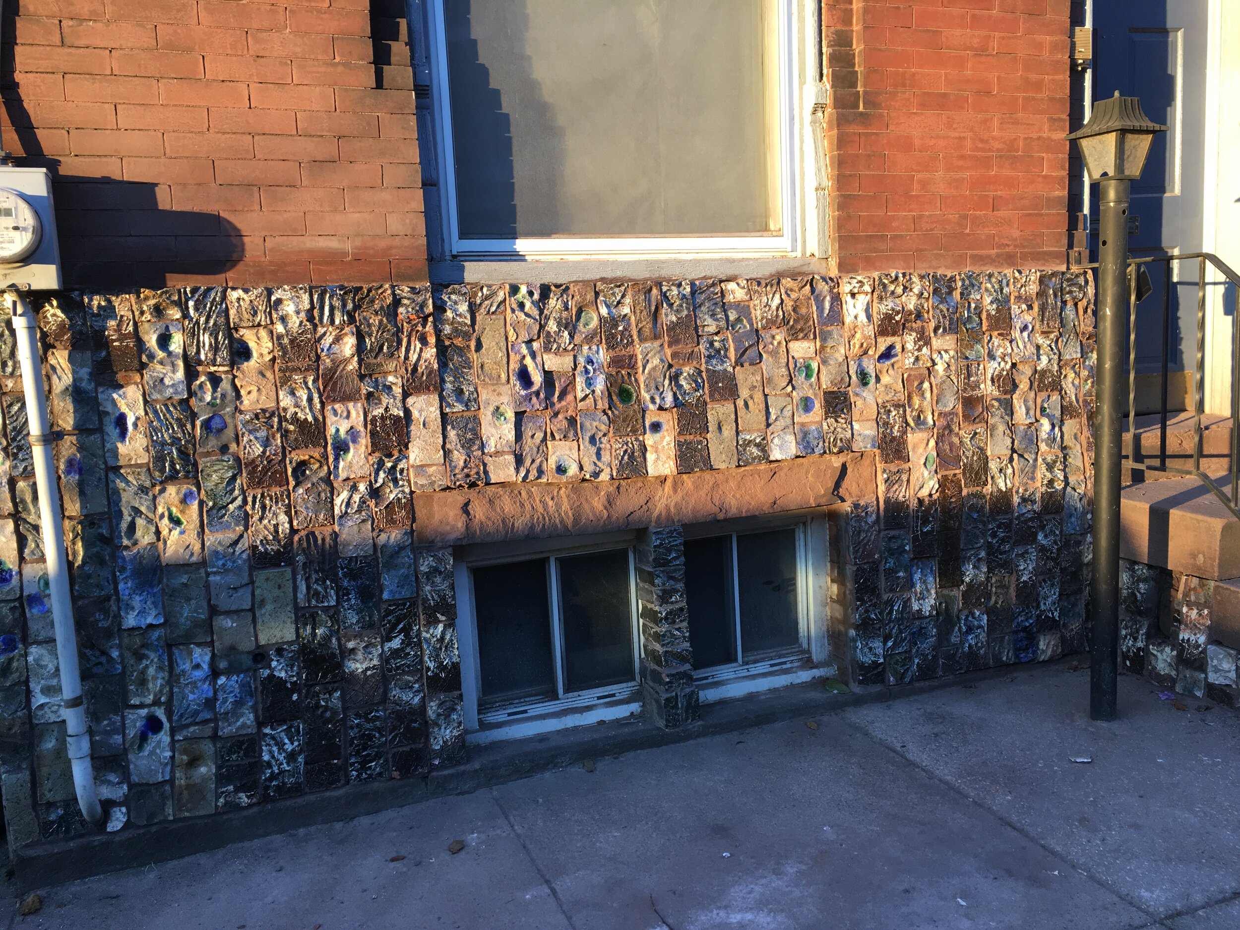 Exterior wall of carved bricks on home 