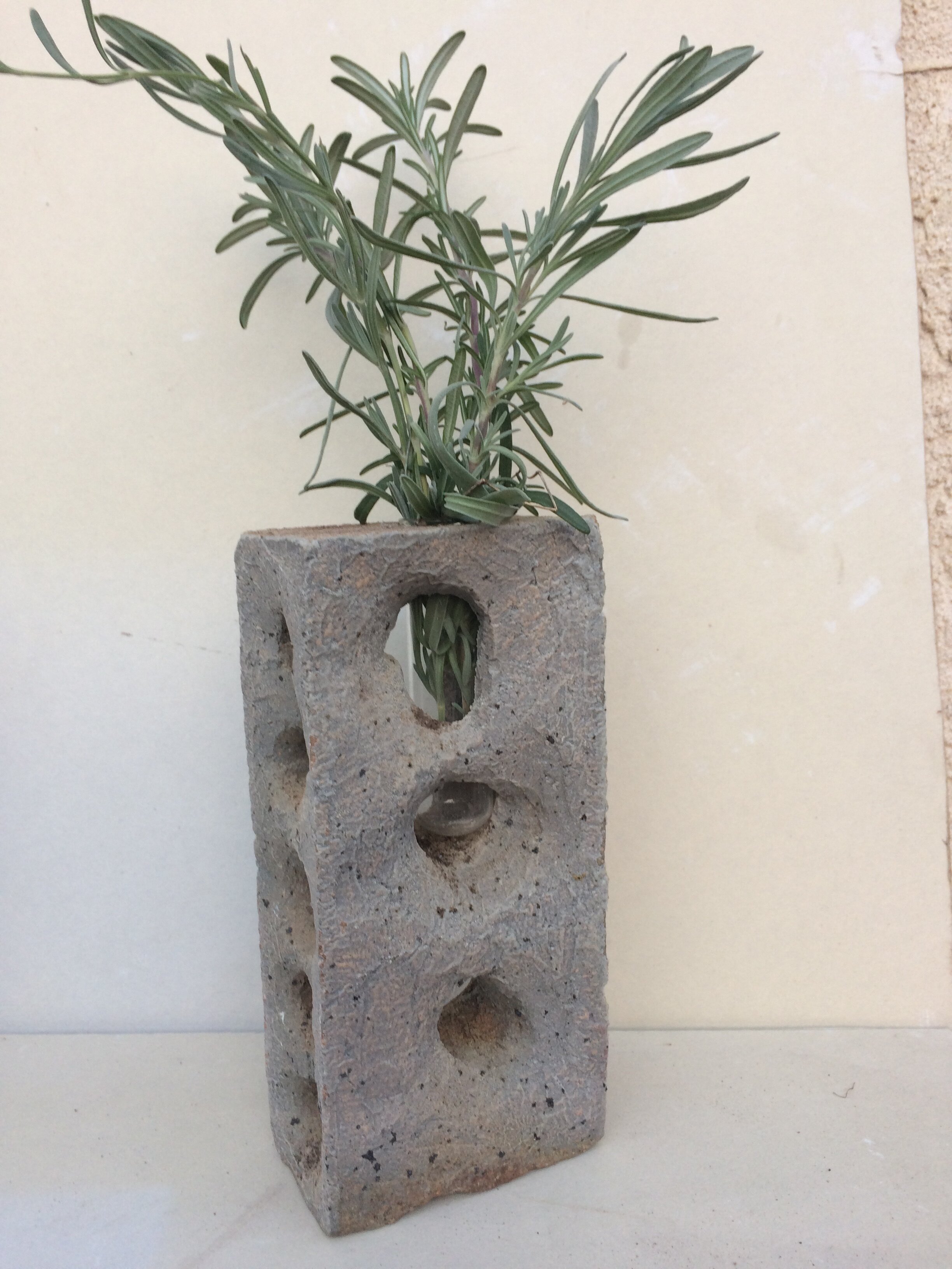 Carved brick holding lavender